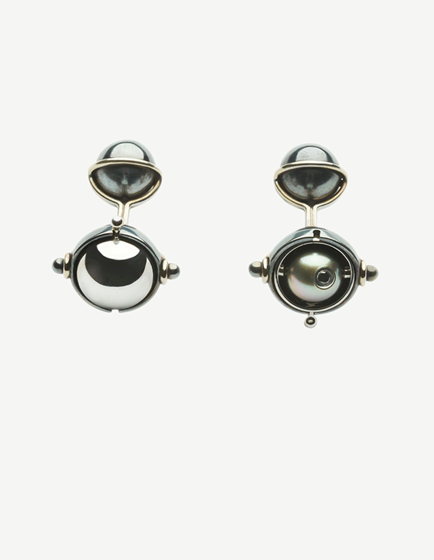 Diamonds Cufflinks set with Tahitian Pearls in 18k white gold by Elie Top. 18K White Gold Distressed Silver Cufflinks. Rotating half-spheres opening on a tahiti pearl encrusted with a diamond.