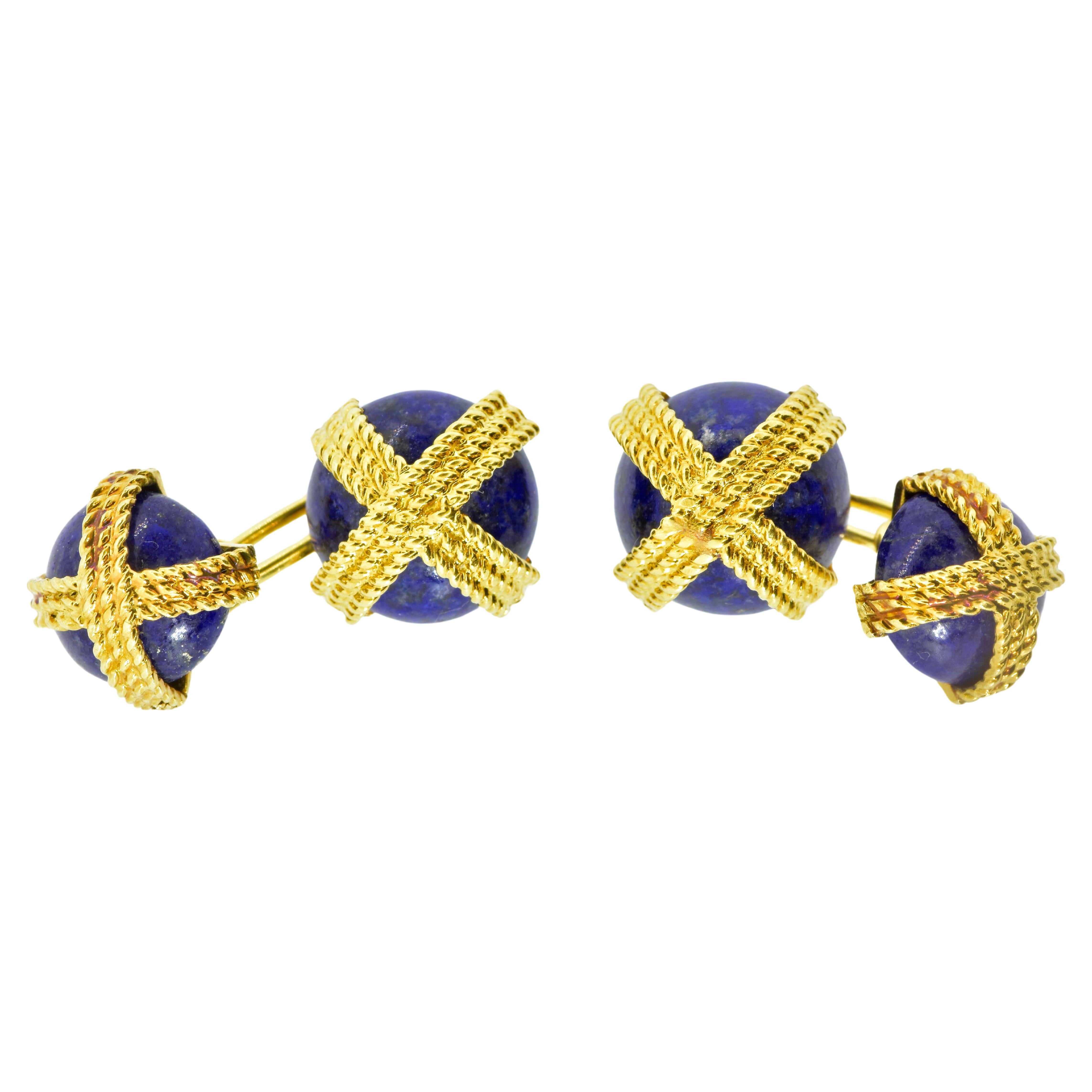 Van Cleef & Arpels Cufflinks 18K yellow gold and fine natural lapis and  back to back. Secured by tightly woven bands of boldly textured 18K gold, the 4 stones of lapis all match well in their vivid blue color.  Usually we see this cufflink in black