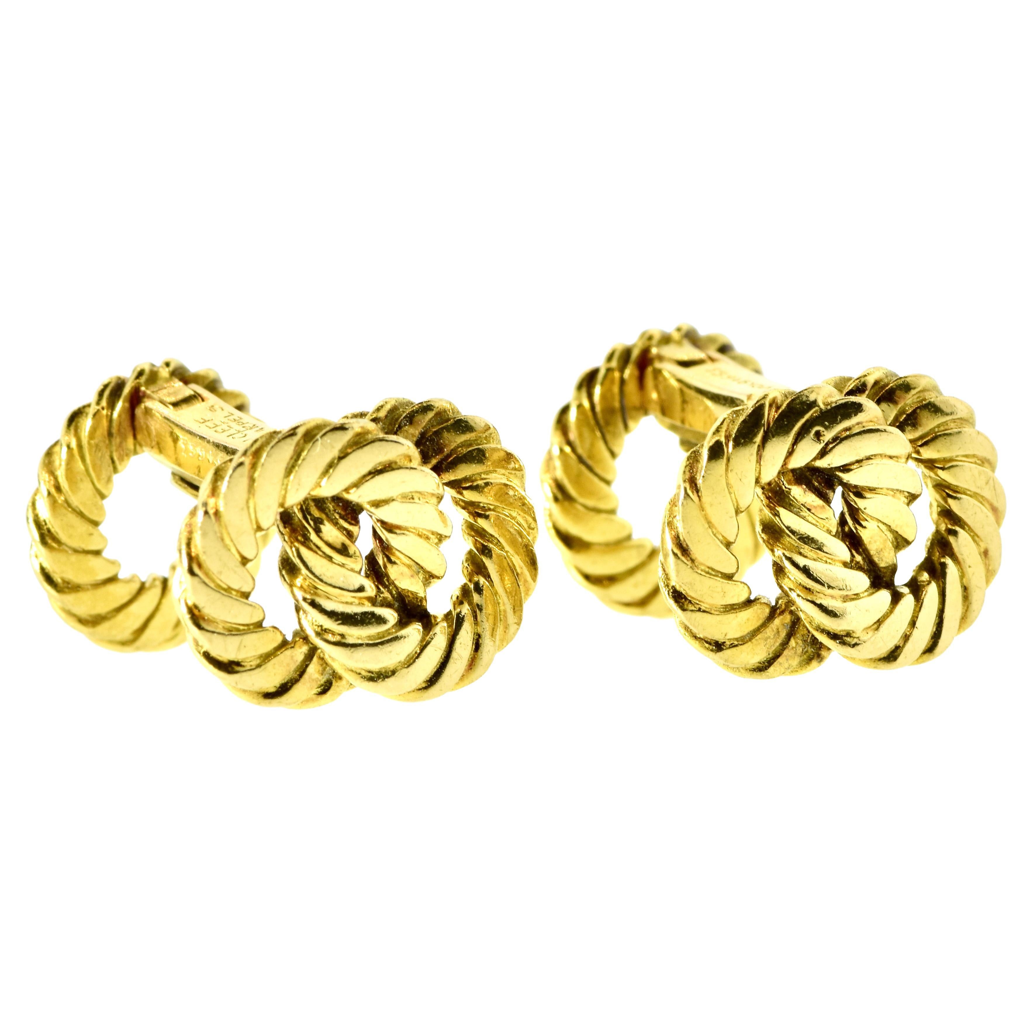 Cufflinks by George L'Enfant for Van Cleef & Arpels, designed as a series of interlocking links, each finely carved.  The cufflinks are signed, hallmarked and numbered along with French gold marks.  The cufflinks, each side slightly different, are