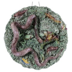 Assiette en majolique lézard et serpent de Cuhna Palissy