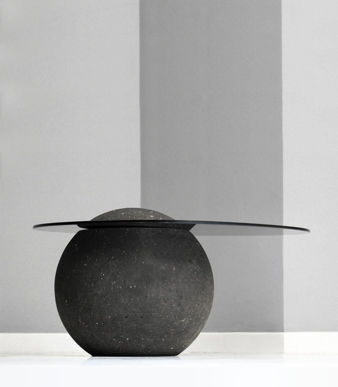 Cuitzeo Side Table by Drusch Design
Dimensions: W 90 x D 60 x H 54 cm
Materials: Cantera stone with a natural matte finish, 9mm smoked tempered glass.
Weight: 175 kg. 

The Cuitzeo side table seamlessly blends Cantera stone and tempered glass in a