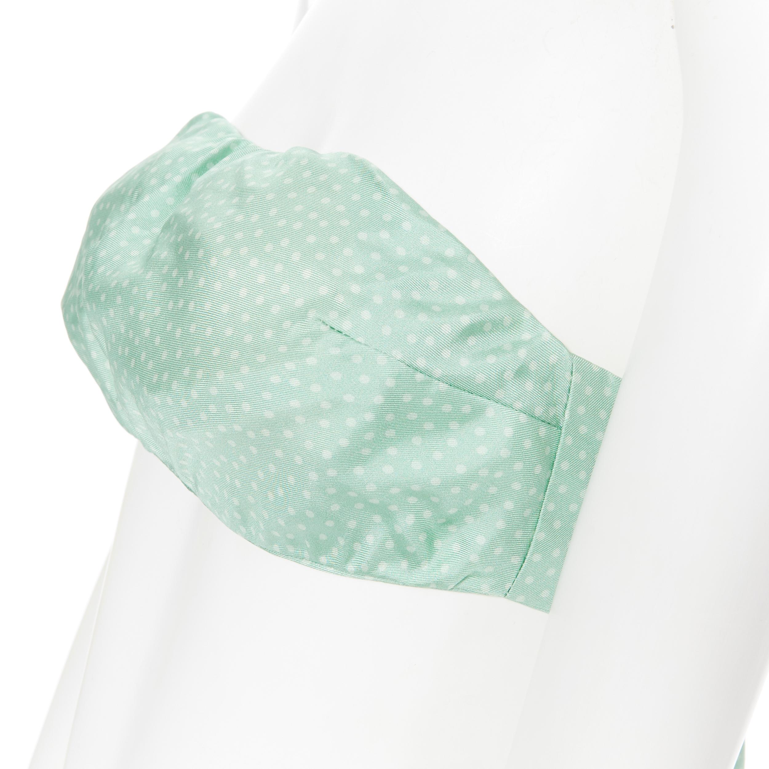 CULT GAIA 100% silk pastel green polkadot padded tie back strapless bandeau XS
Brand: Cult Gaia
Model Name / Style: Bustier top
Material: Silk
Color: Green
Pattern: Polka Dot
Closure: Tie
Extra Detail: Padded bust. Bust darts. Self tie. Strapless