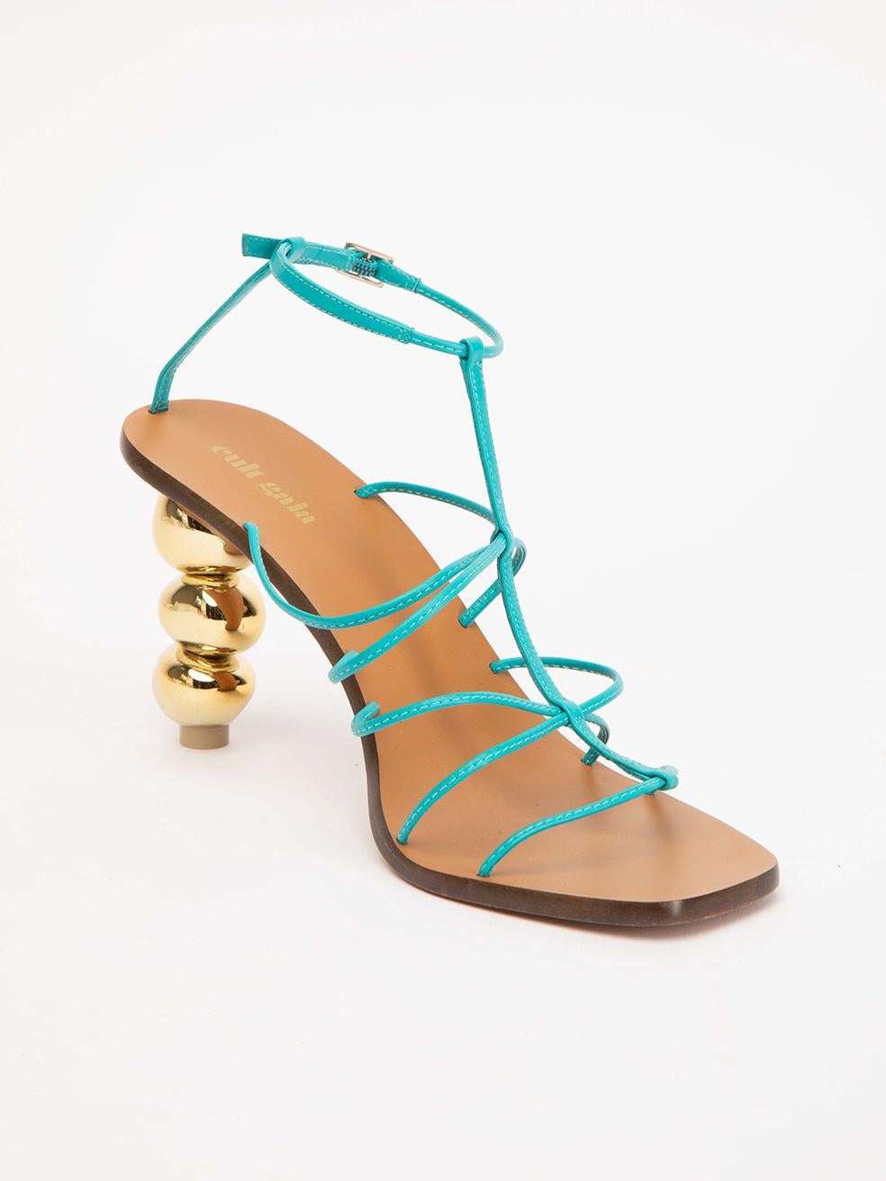 CONDITION is Very good. Hardly any visible wear to sandals is evident. Very minimal wear to the midsole and the outsole on this used Cult Gaia designer resale item. 
 
 Details
 Blue
 Leather
 Strappy sandals
 Open square toe
 High heel
 Gold