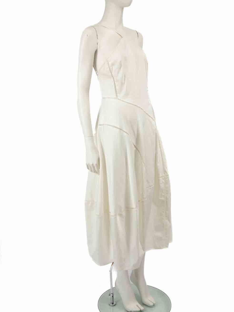 CONDITION is Good. General wear to dress is evident. Moderate signs of wear to the front and neck-edge with discoloured marks on this used Cult Gaia designer resale item.
 
 
 
 Details
 
 
 White
 
 Cotton
 
 Dress
 
 Midi
 
 Asymmetric top- one