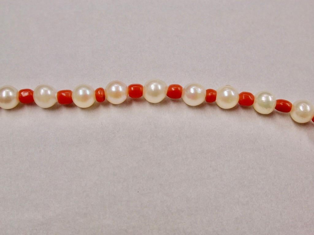 Cultered Pearl And Coral Bead Necklace with Matching Bracelet, Circa 1970
The necklace is 28 inches long and the bracelet is 7 inches long.
Both snaps are silver gilt, 800 standard.
Probably Italian.