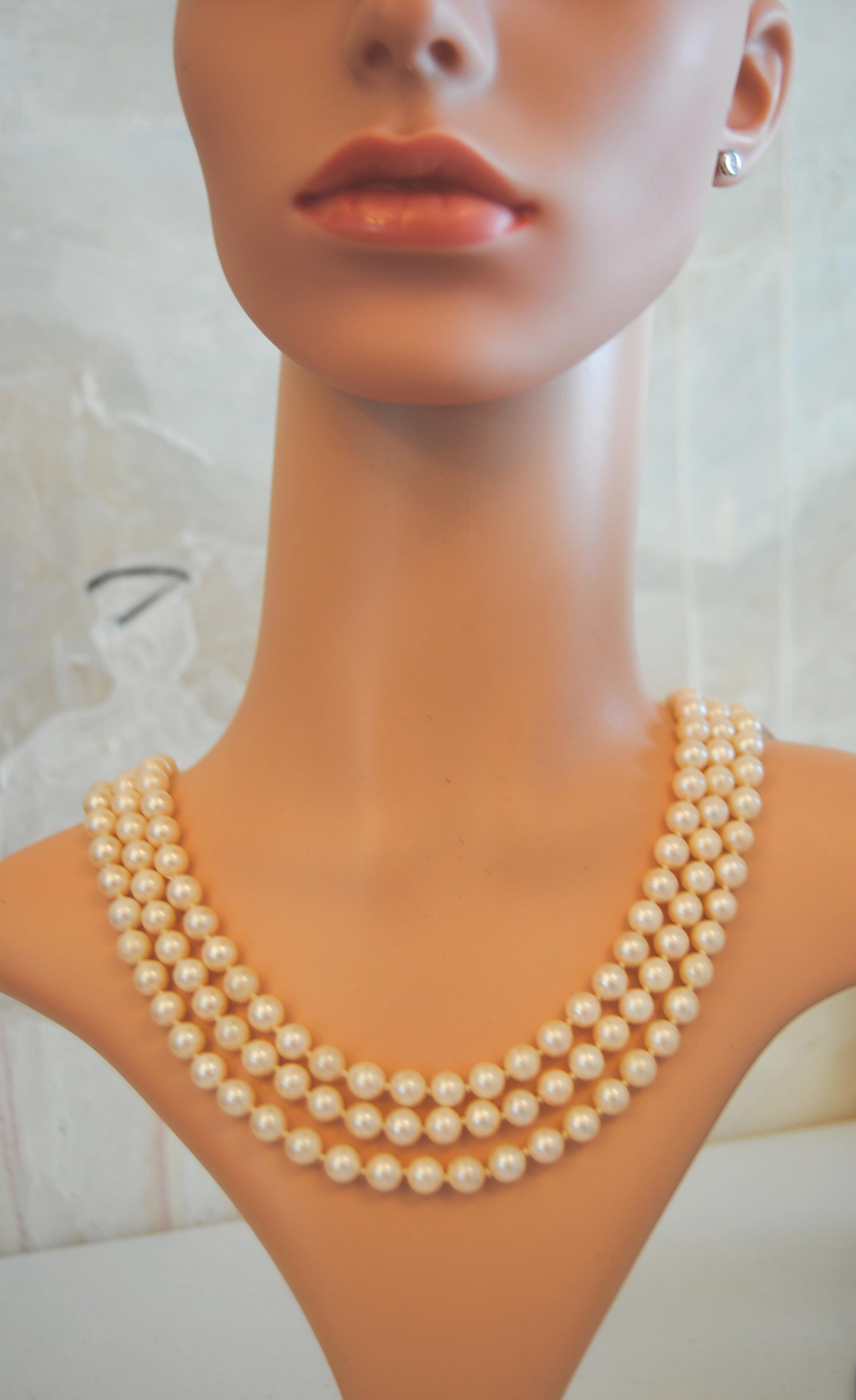 A classic yet contemporary  3 strand cultivated south sea (Japanese) pearl necklace of  8.3mm/0.32 inches   with a retro flower in 18kt gold and center of pearls and tulips of turquoise clasp closure 
The pearls are Japanese cultivated with thick