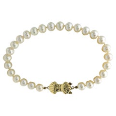 Cultured Akoya Pearl 7.5" Strand Bracelet with 14 Karat Yellow Gold Bow Clasp