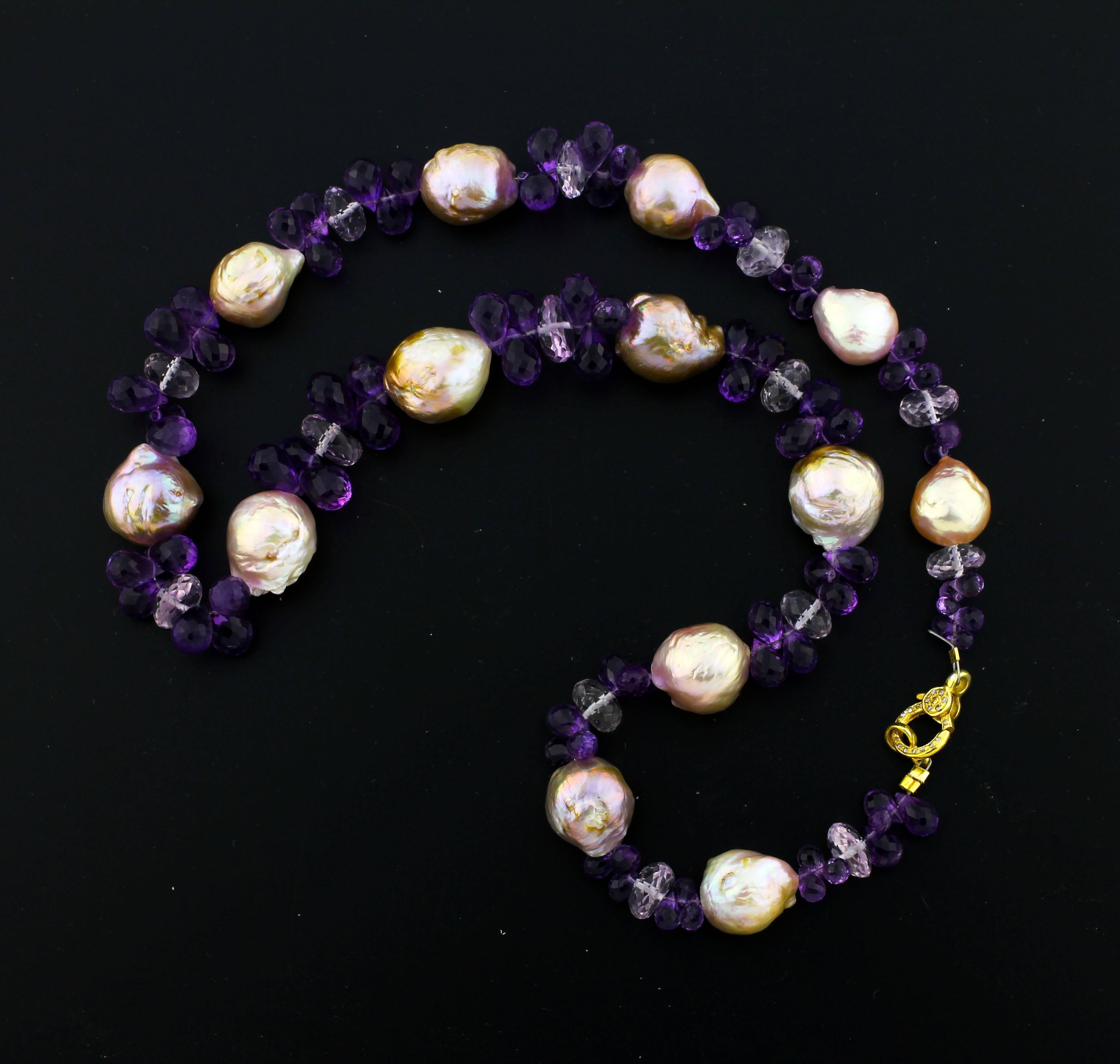 These fresh water cultured goldy tone Wrinkle Pearls are enhanced with sparkling checkerboard gem cut Amethyst Briolets and glittering Rose of France.  They are set with a Vermeil (sterling silver gold plated) clasp inset with tiny diamonds.  It is