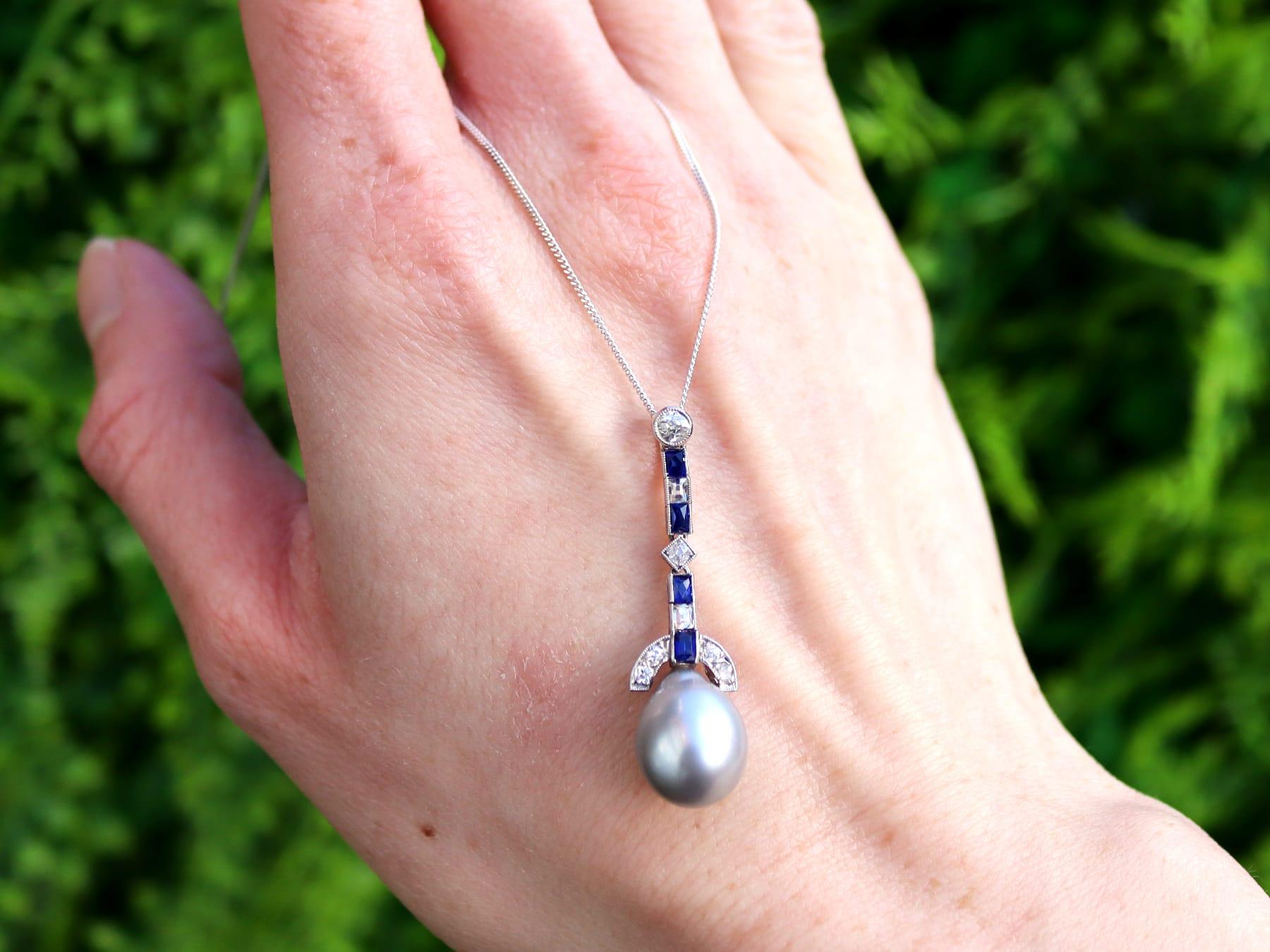 A fine and impressive antique and contemporary cultured pearl, 0.30 carat sapphire and 0.35 carat diamond, platinum pendant; part of our pearl jewelry collections.

This stunning, fine and impressive pearl drop pendant has been crafted in