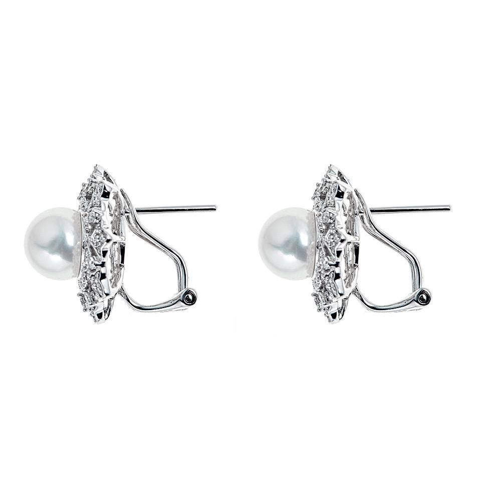 Handmade 14k white gold earrings featuring an 8mm cultured pearl in the center surrounded with a beautiful flower design accented with approximately .51 CT in round diamonds (GH color, SI-SI2 clarity)