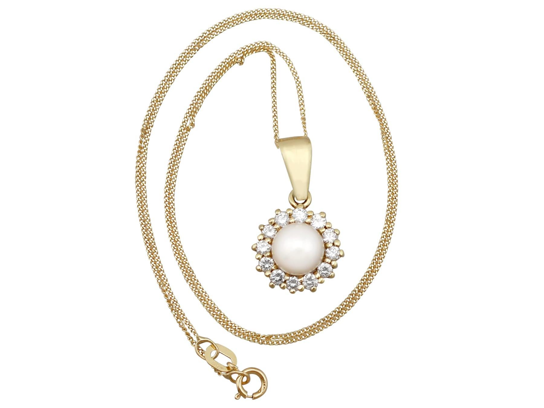 An impressive vintage 1970s cultured pearl and 0.48 carat diamond, 14 karat yellow gold pendant; part of our diverse pearl jewelry and estate jewelry collections.

This fine and impressive cultured pearl and diamond pendant has been crafted in 14k