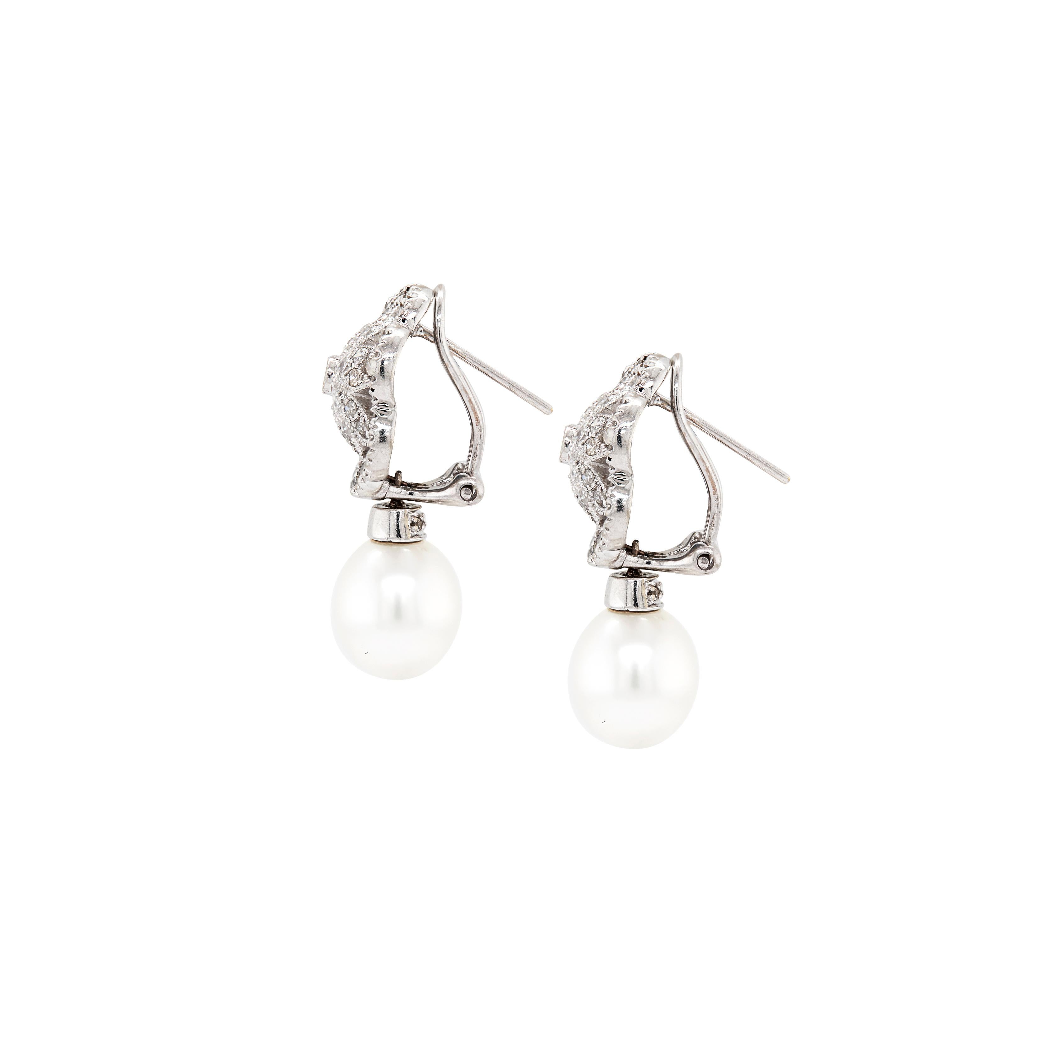 These exquisite drop earrings are a timeless addition to any jewellery collection that could easily become a cherished heirloom piece.

Each earring features a lustrous cultured pearl, measuring approximately 8.5 x 9.5mm, suspended as a delicate