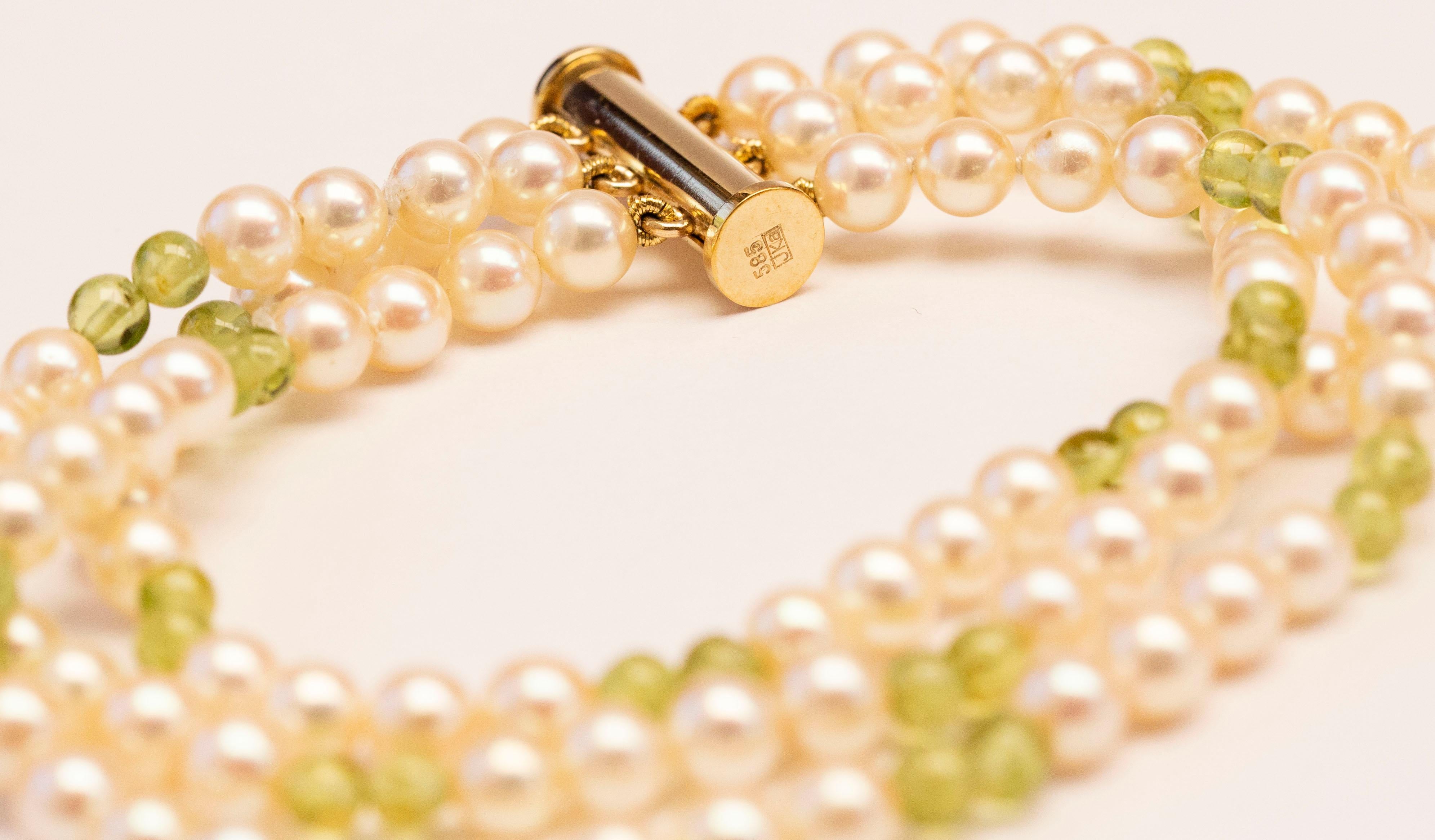 Retro Cultured Pearl and Peridot Triple Strand Bracelet with 14 Karat Gold Closure For Sale