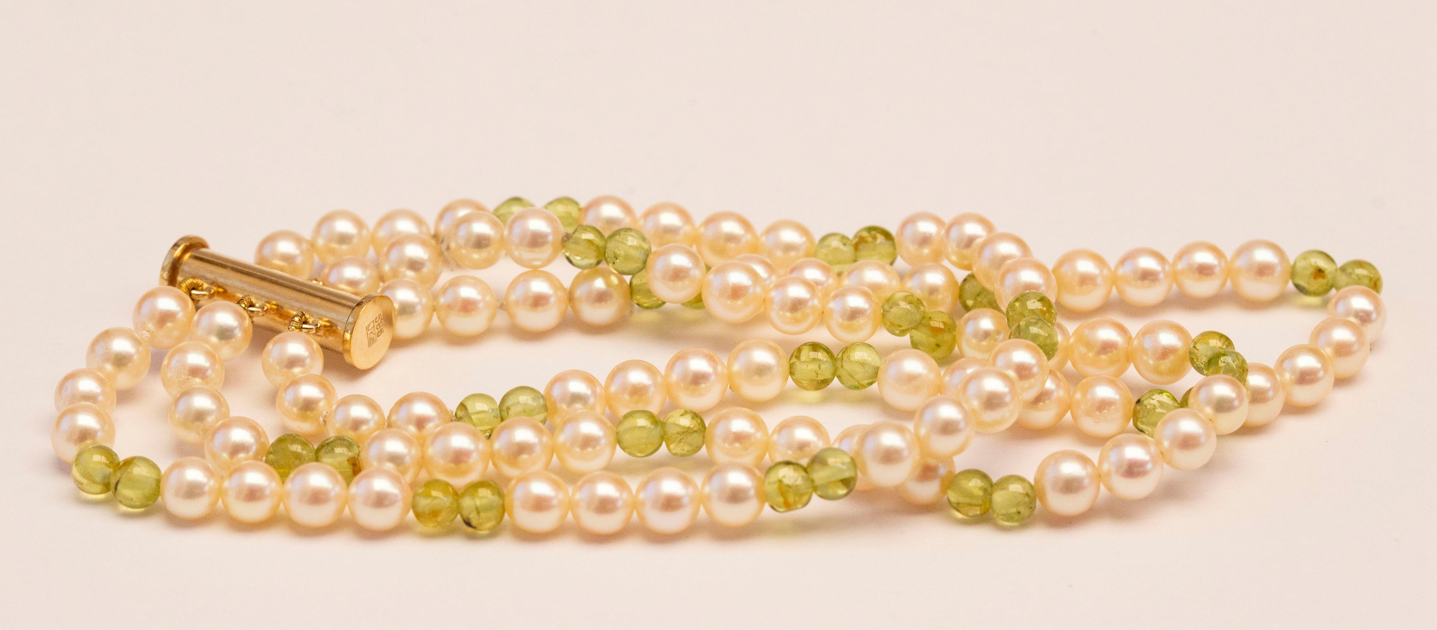 Round Cut Cultured Pearl and Peridot Triple Strand Bracelet with 14 Karat Gold Closure For Sale