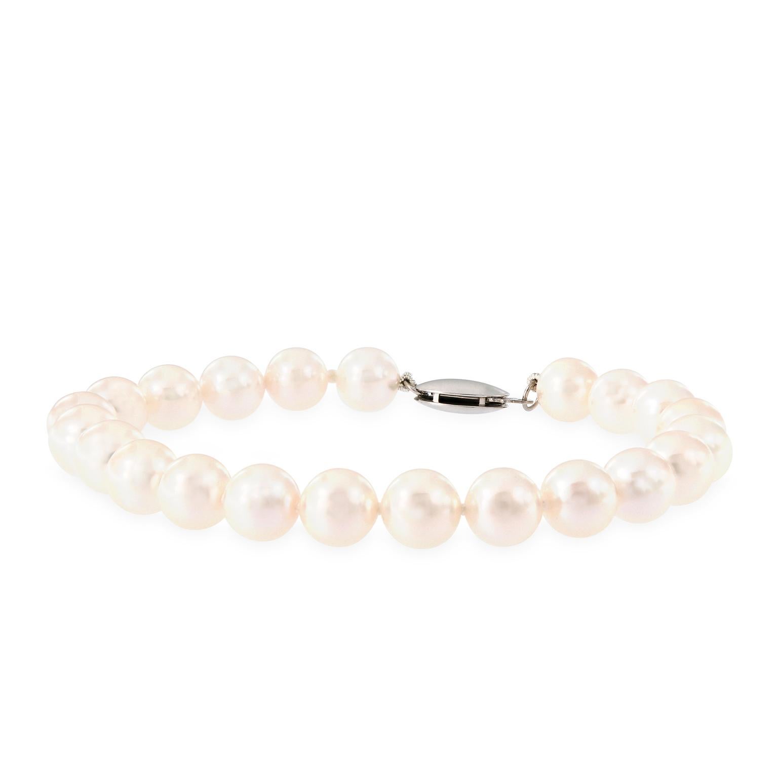 The perfect gift for graduation or confirmation! This bracelet features 22 cultured white pearls with rose' overtones . Pearls are hand-knotted and held secure to the wrist with a 14k white gold fish hook clasp. Pearls are 7-7.5mm and AA quality.