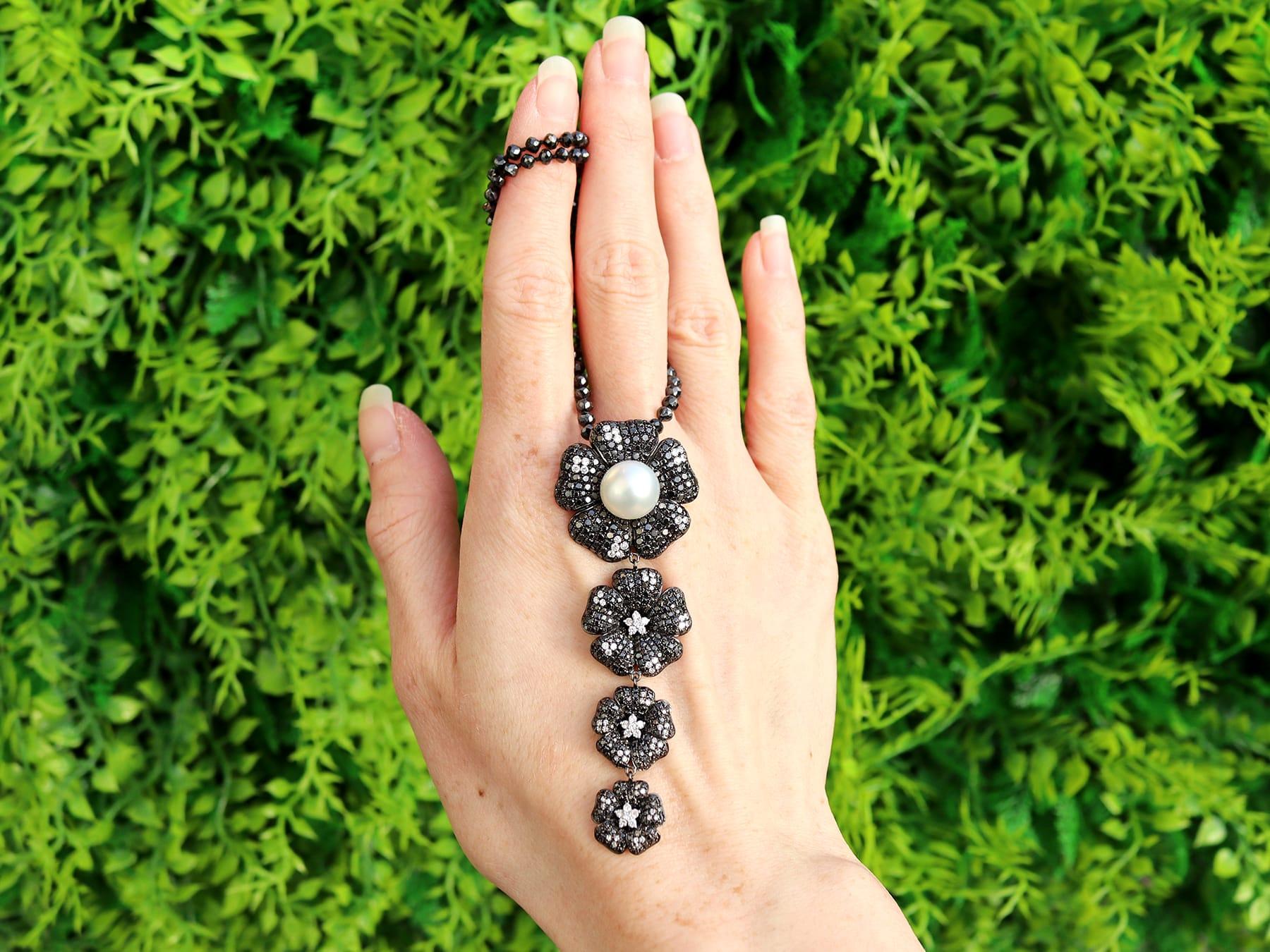 A stunning, fine and impressive vintage cultured pearl and 37.05 carat diamond, 18 karat oxidised white gold necklace; part of our diverse floral jewelry and estate jewelry collections.

This stunning, fine and impressive vintage necklace has been