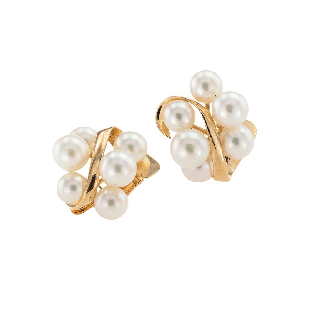 Vintage cultured pearl cluster and yellow gold clip-on earrings circa 1960.  

We are here to connect you with beautiful and affordable antique and estate jewelry.

SPECIFICATIONS:

Contact us right away if you have additional questions.

CULTURED