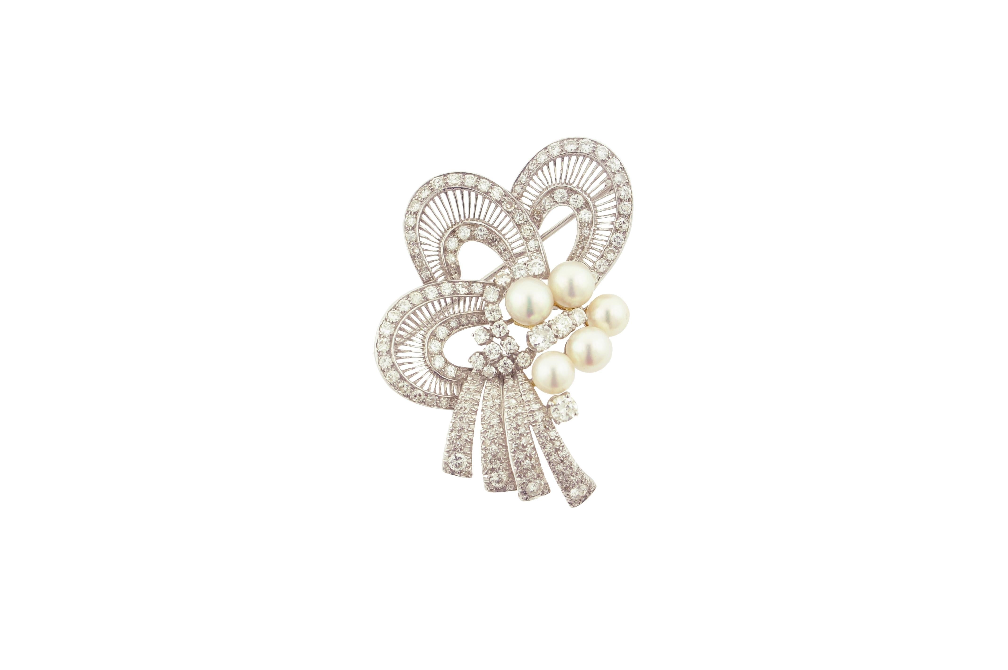 Beautiful pearl and diamond brooch set in 18 karat white gold.

5 cultured pearls ranging from 7.00mm to 7.80mm.

17 round diamond weighing approximately 1.70 carats

130 diamond weighing approximately 2.60 carats

Total diamond weight is