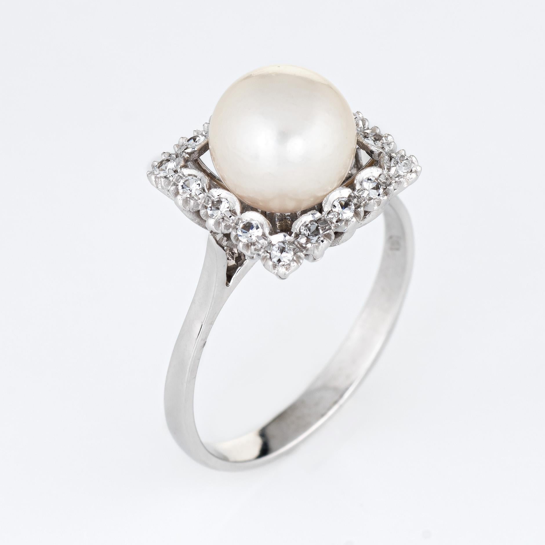 Stylish vintage cultured pearl & diamond ring (circa 1970s to 1980s) crafted in 18 karat white gold. 

The cultured pearl measures 8.5mm, accented with an estimated 0.16 carats (estimated at H-I color and VS2-SI1 clarity).  

The cultured pearl is