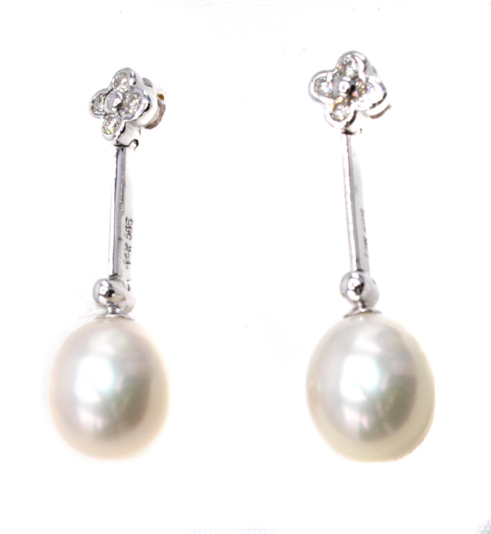 These chic and flexible ear pendants feature 2 perfectly matched tear-drop shape cultured pearls measuring 11 millimeters in length and 8.9 millimeters in width. The pearls have an amazing luster and are white in color with a slight cream hew. Each