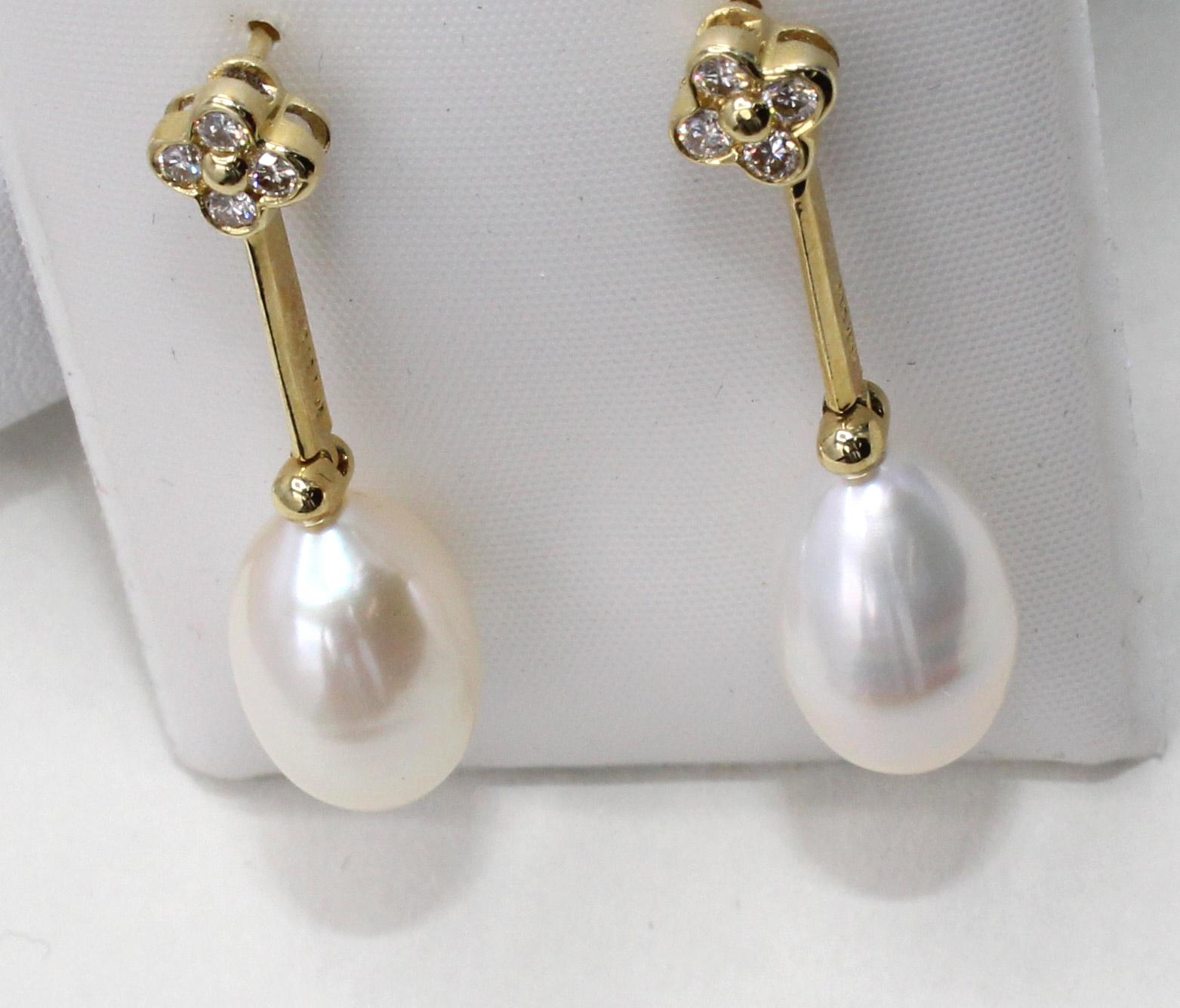 These chic and flexible ear pendants feature 2 perfectly matched tear-drop shape cultured pearls measuring 13.30 millimeters in length and 8.6 millimeters in width. The pearls have an amazing luster and are white in color with a slight cream hew.