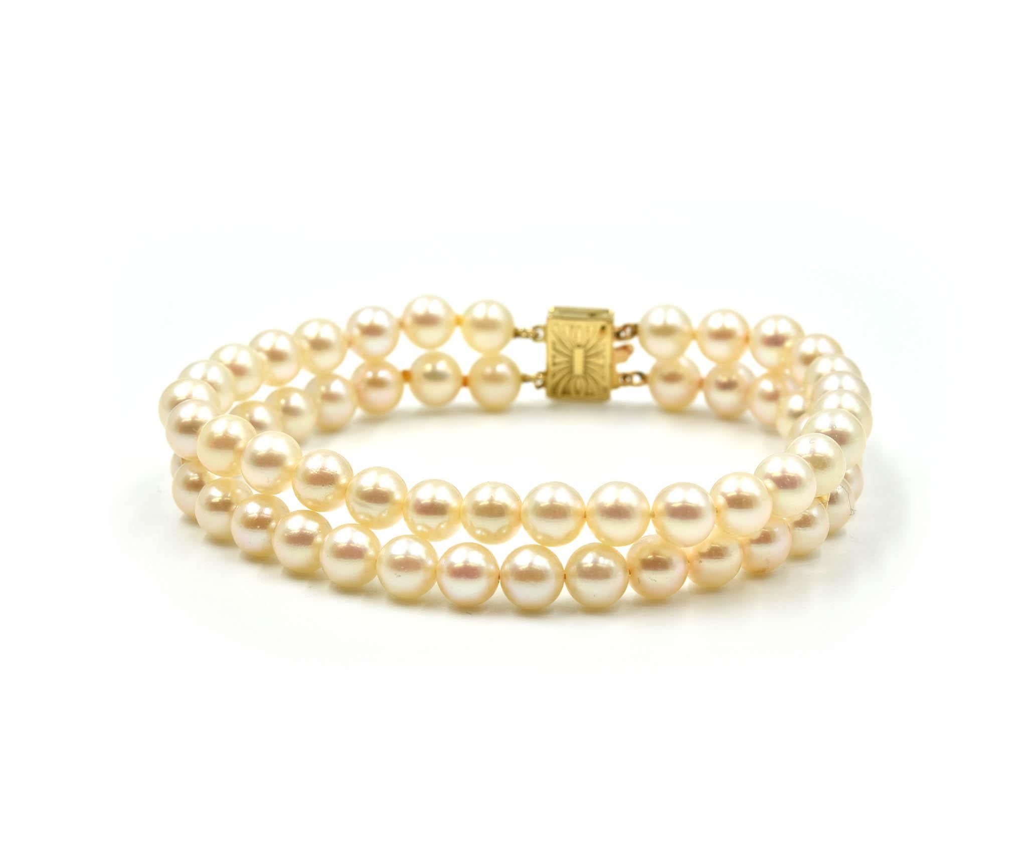 Designer: custom design
Material: 14k yellow gold
Pearls: round cultured pearls 5.80mm in diameter with silver overtones
Dimensions: bracelet will fit up to a 7-inch wrist, bracelet is a 1/2 inch wide
Weight: 17.10 grams
