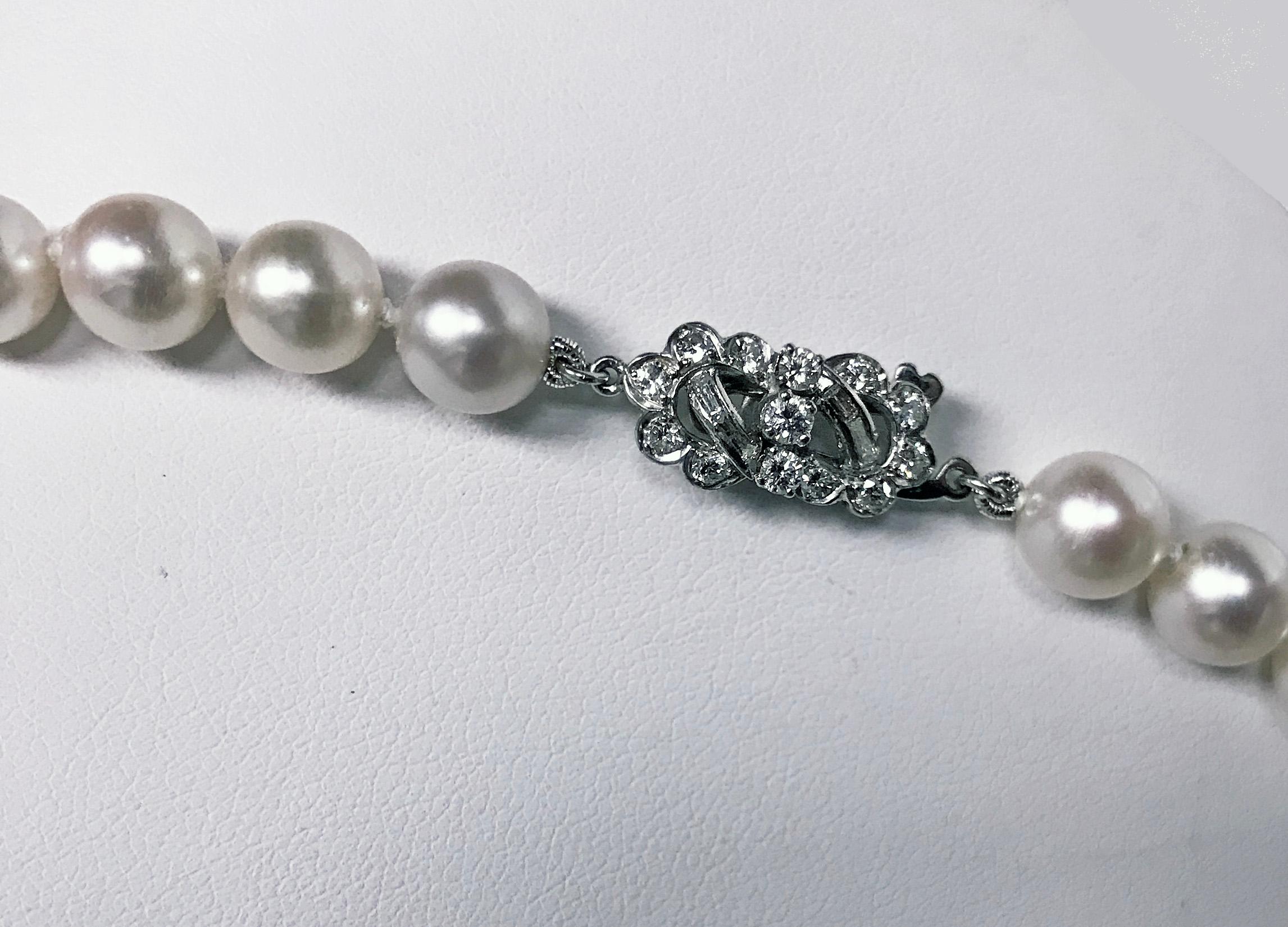 Fine Cultured Pearl Necklace with Platinum (acid tested)  Diamond clasp, 1960's  The pearls comprising forty four round cultured pearls gauging approximately 7.50 - 8.50 mm, light cream with mixed overtones, thick nacre, good lustre, good finish.