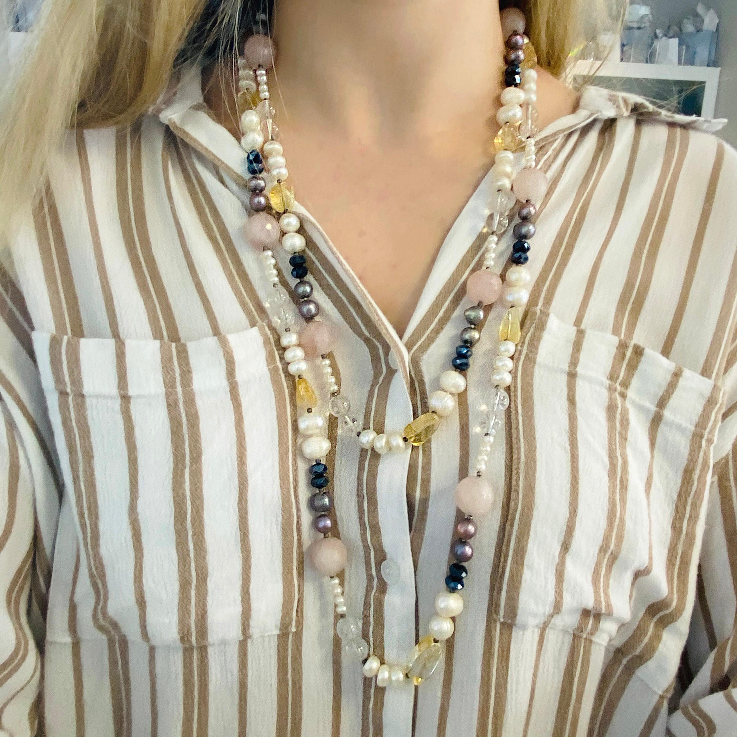 This one-of-a-kind genuine pearl and gemstone necklace is a statement piece! The cultured pearls are white and black and paired with genuine rose quartz, genuine amethyst, genuine citrine. This necklace was hand-made by our jewelers so it is a