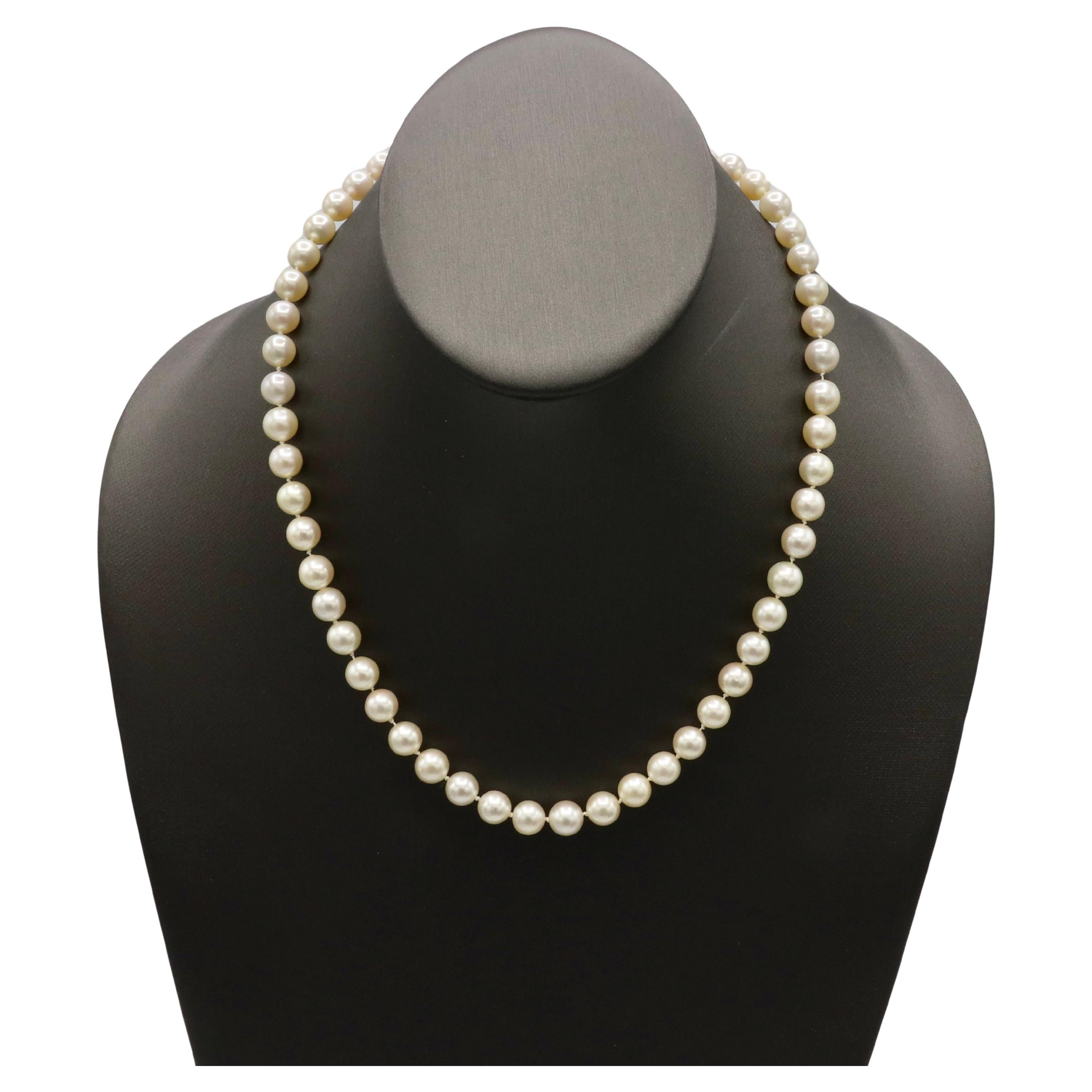 Cultured Pearl Necklace With 14 Karat Yellow Gold Clasp 
Metal: 14k yellow gold
Weight: 34.5 grams
Pearls: Cultured, 7.5-8mm creamy white color with high luster
Length: 17 inches
