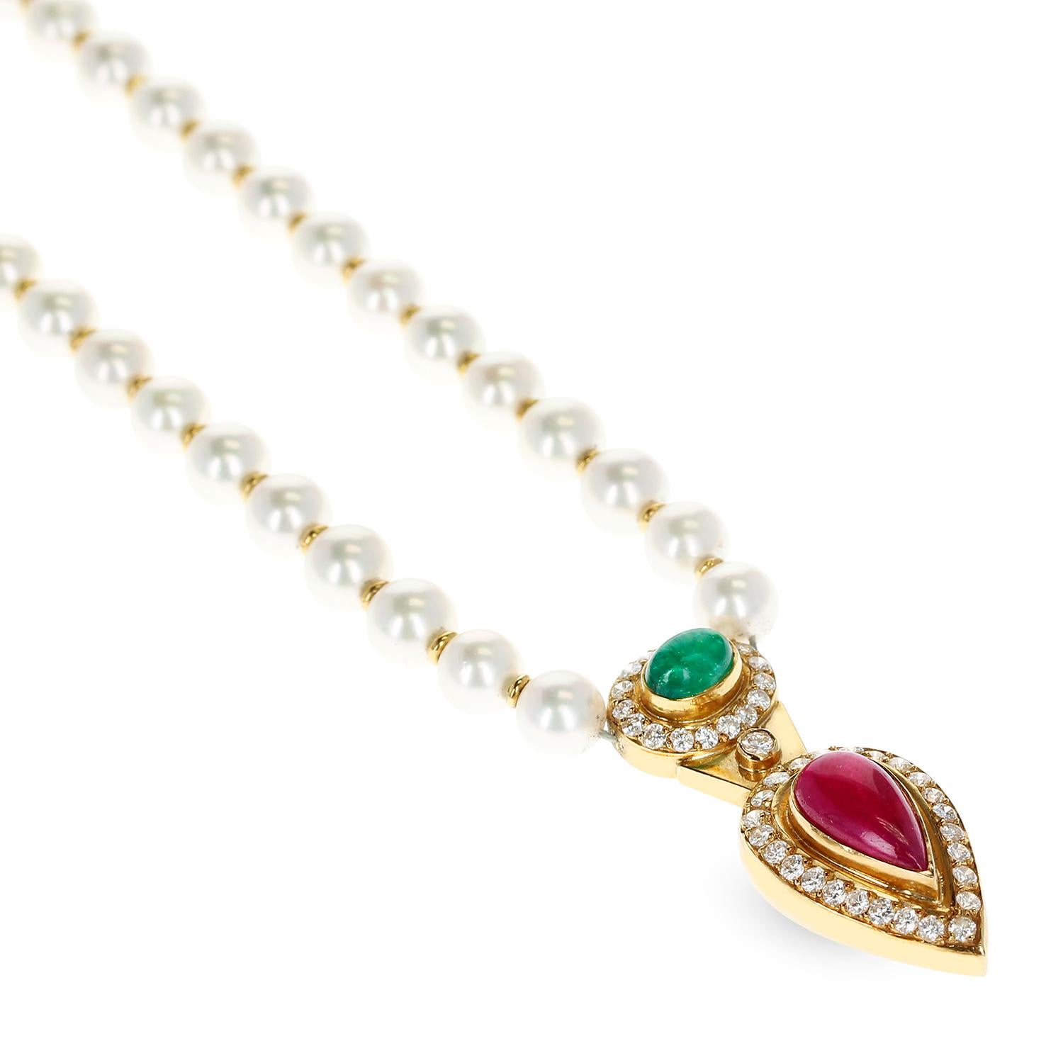 A Cultured Pearl Necklace with an Oval Emerald Cabochon, a Pear-Shape Ruby Cabochon, and Diamonds on the pendant and on the clasp as well. Each bead has a gold spacer in between. The length of the entire necklace from the clasp to the bottom of the