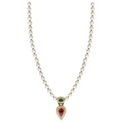 Cultured Pearl Necklace with an Emerald and Ruby Cabochon, and Diamonds