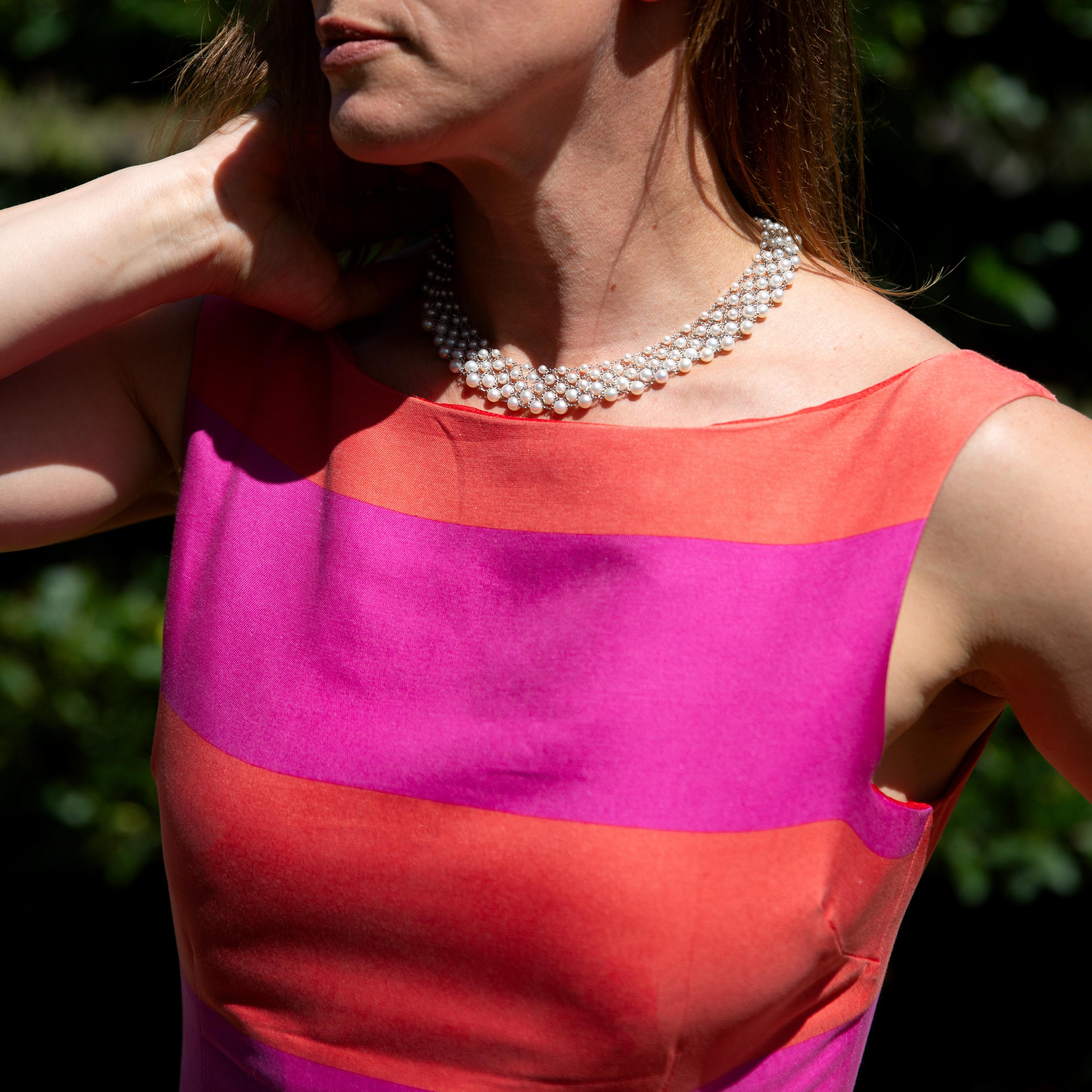 A luxurious multi-strand cultured pearl collar necklace, intricately woven into a wide mesh pattern and finished with an 18kt white gold clasp set with diamonds. Elegant and timeless, this piece exudes classical sophistication and comes in a Mozeris