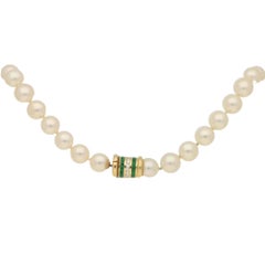 Cultured Pearl Row with Diamond and Emerald Clasp