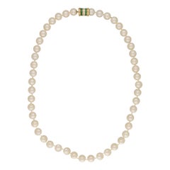 Cultured Pearl Row with Diamond and Emerald Clasp