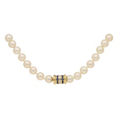 Cultured Pearl Row with Diamond and Sapphire Clasp