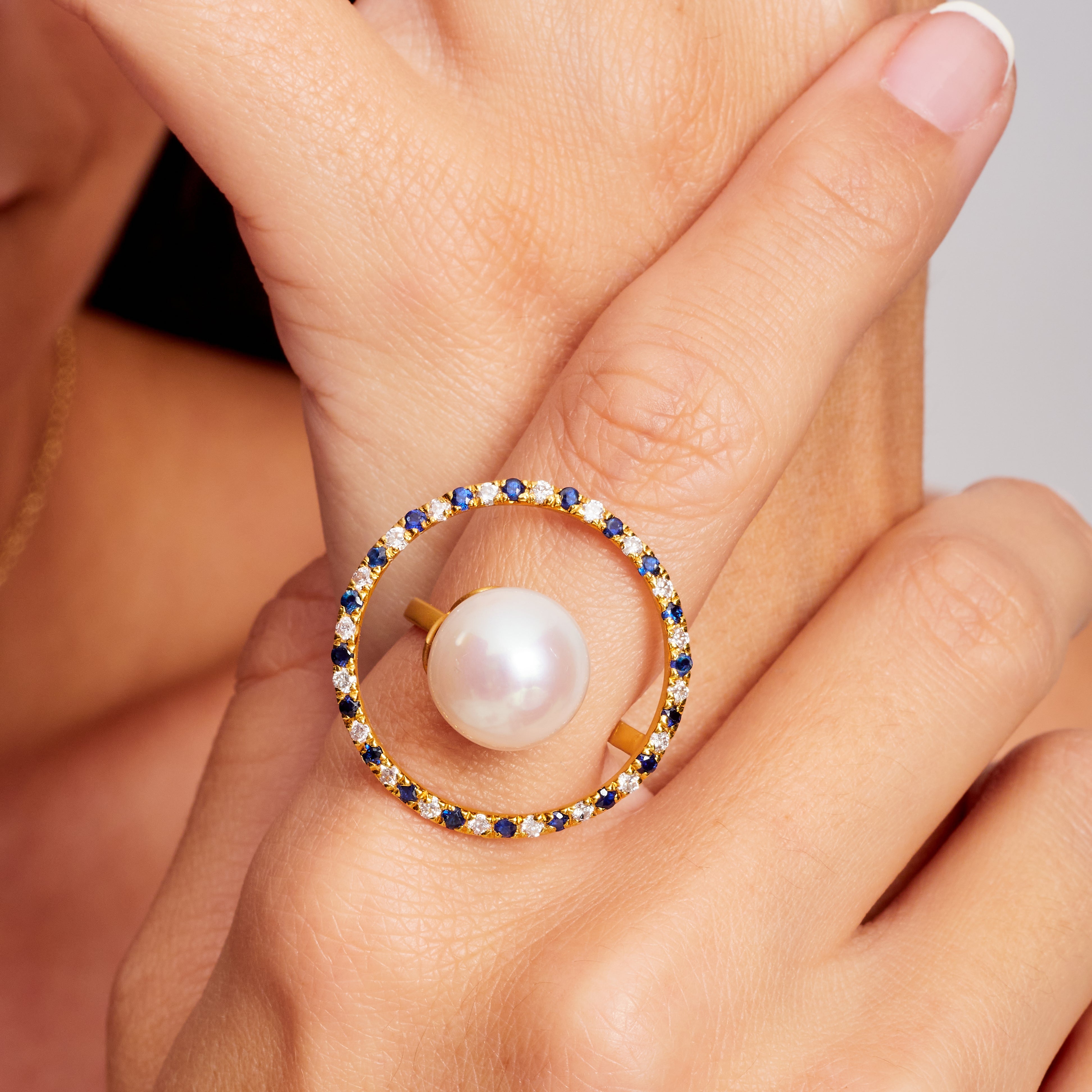Modern 16 Carat Cultured Pearl, Sapphire, Diamond, and Yellow Gold Cocktail Ring For Sale