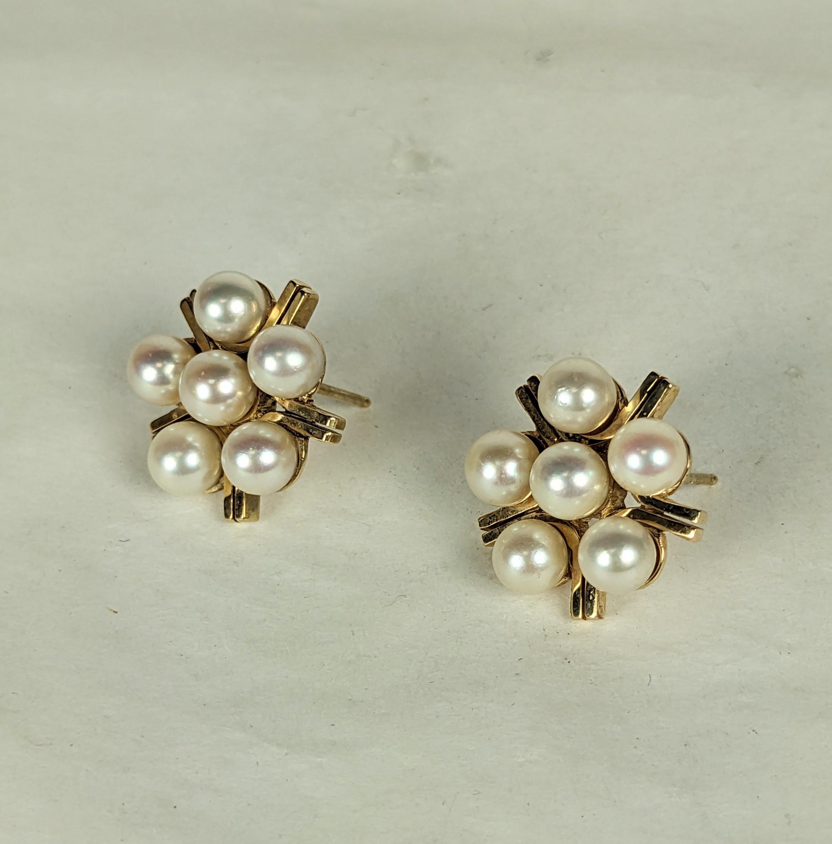 Classic cultured Pearl Star Form Earrings set in 14k gold. 6 cultured pearls are set within a star form frame of heavy gold. High quality manufacture. .75