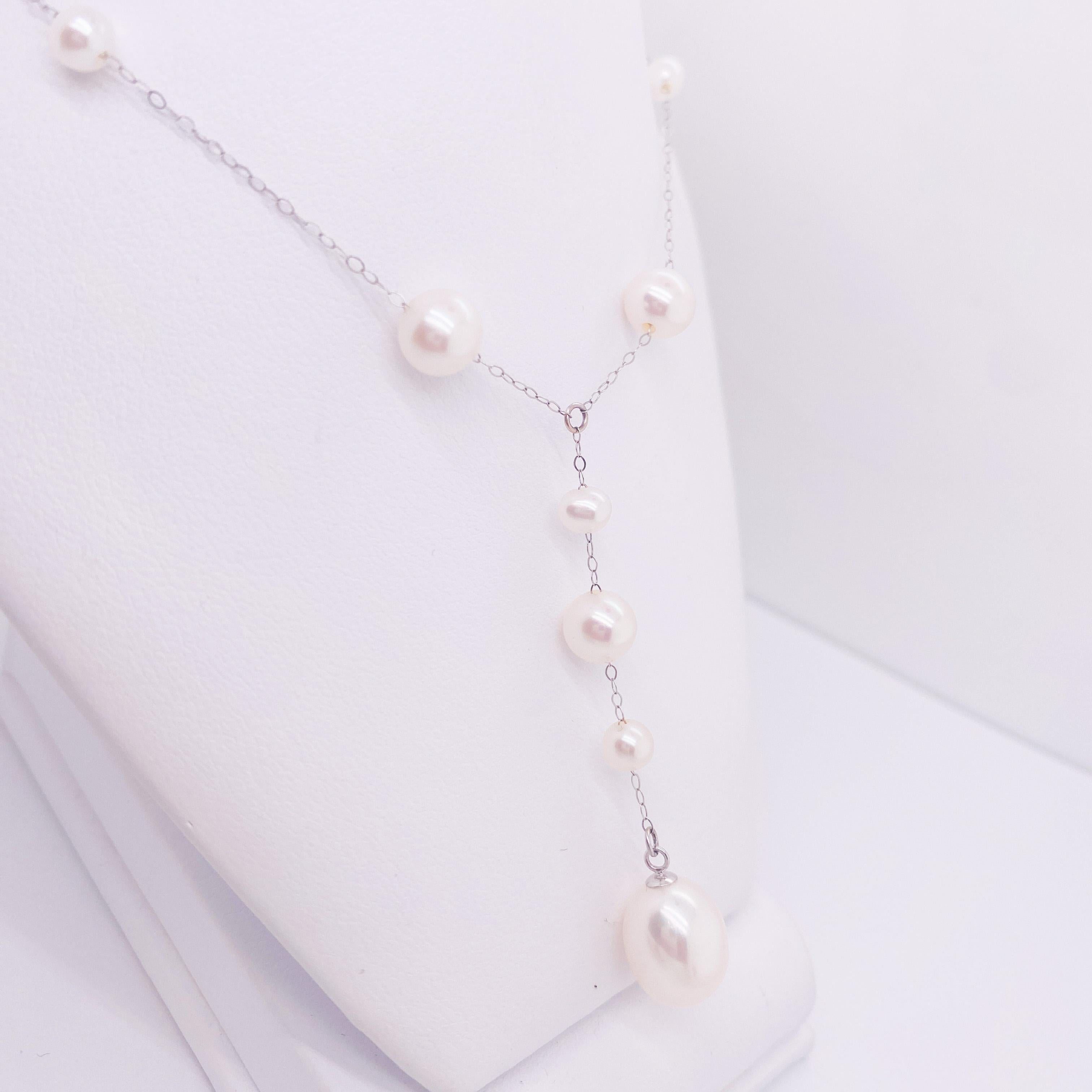 This pearl drop necklace is a lovely and bright look, especially for a wedding! The elegant dance of alternating size pearls down the length of chain is delightful. The drop at the center of the chain hangs 2.25 inches down and creates a lovely