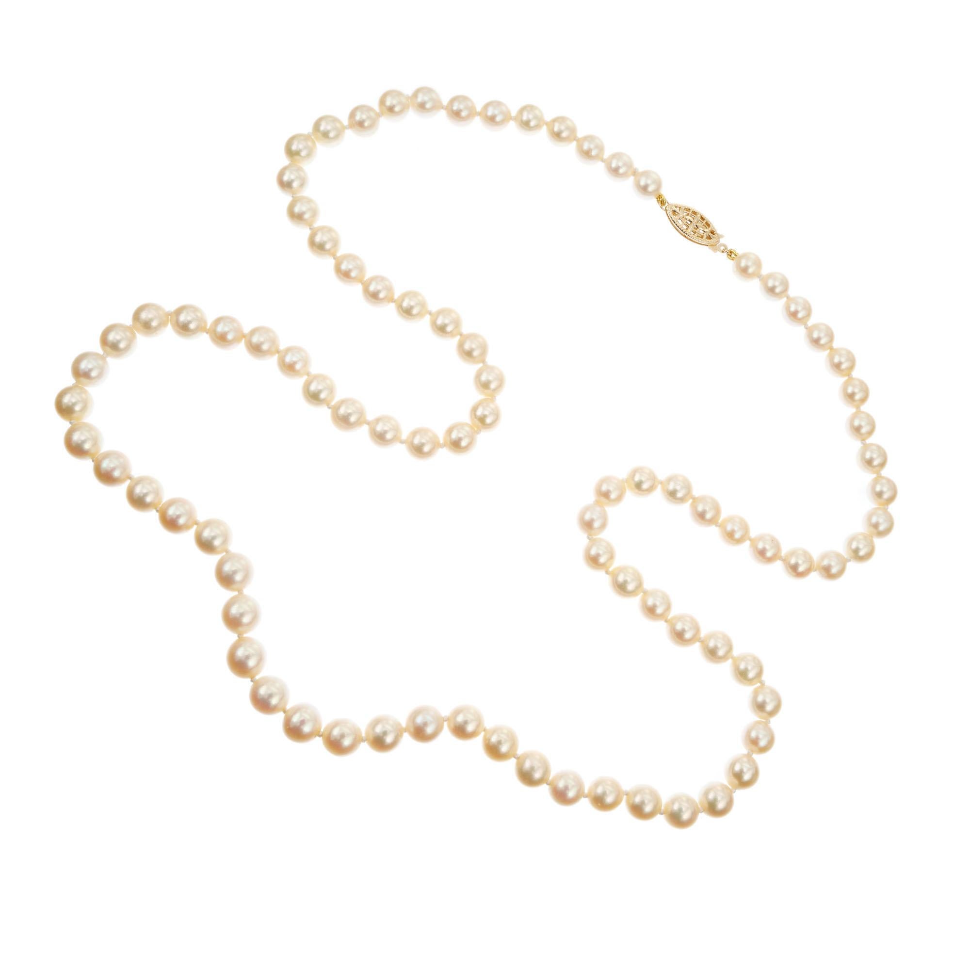 Mid-Century 1960's, High lustre well matched Japanese cultured pearl necklace. Natural cream color. Few blemishes. Can be worn doubled around the neck. Freshly strung to a new 14k yellow gold catch. 28 inches long. 

85 cultured creme pearls,