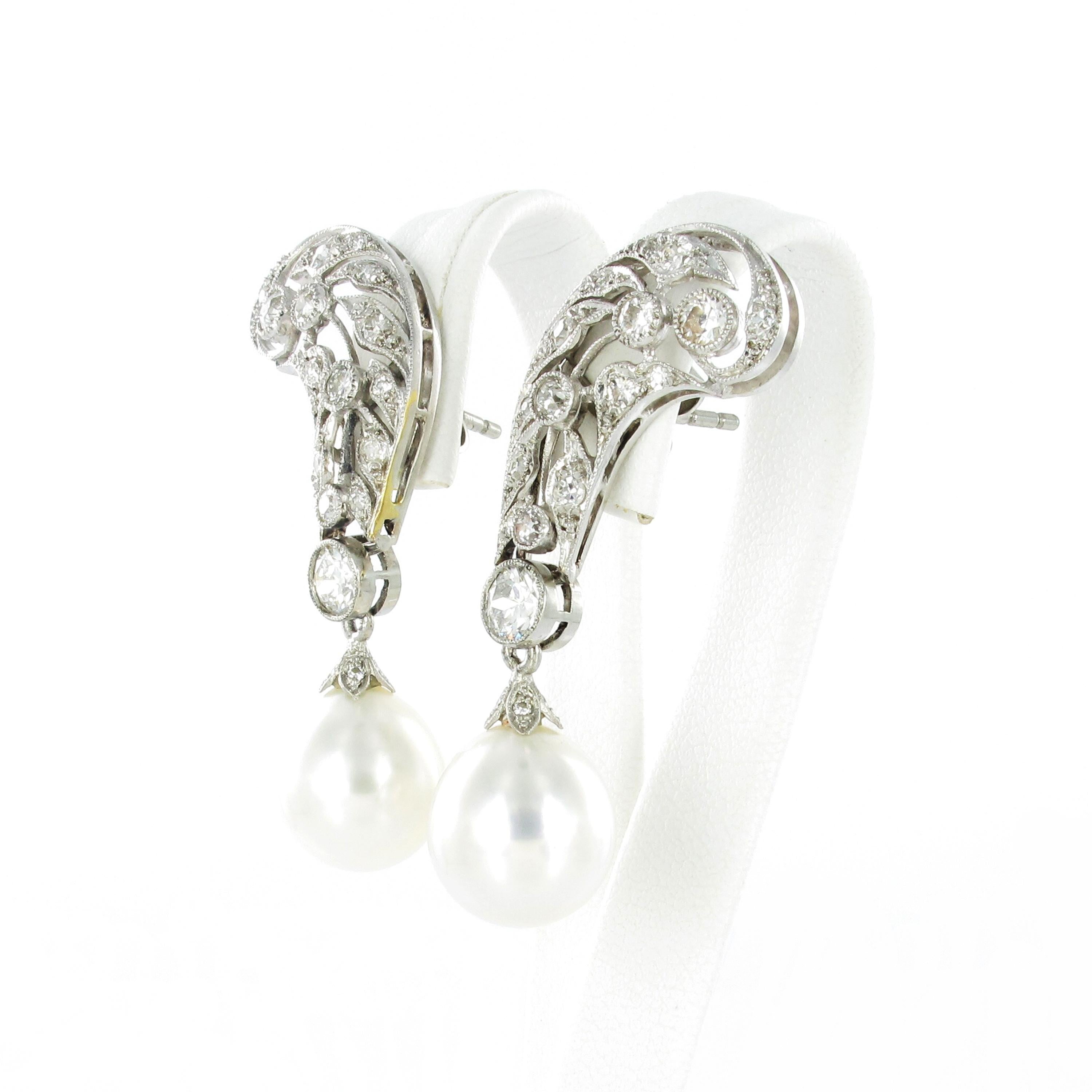 Fabilous pair of earrings in Platinum 950. The pair is approximate from the 1940ies and nicely crafted. Millgraine set with 60 old cut diamonds totaling approximate 2 ct. The diamonds are of G/H color and vs/si1 clarity. 
The two drop shaped