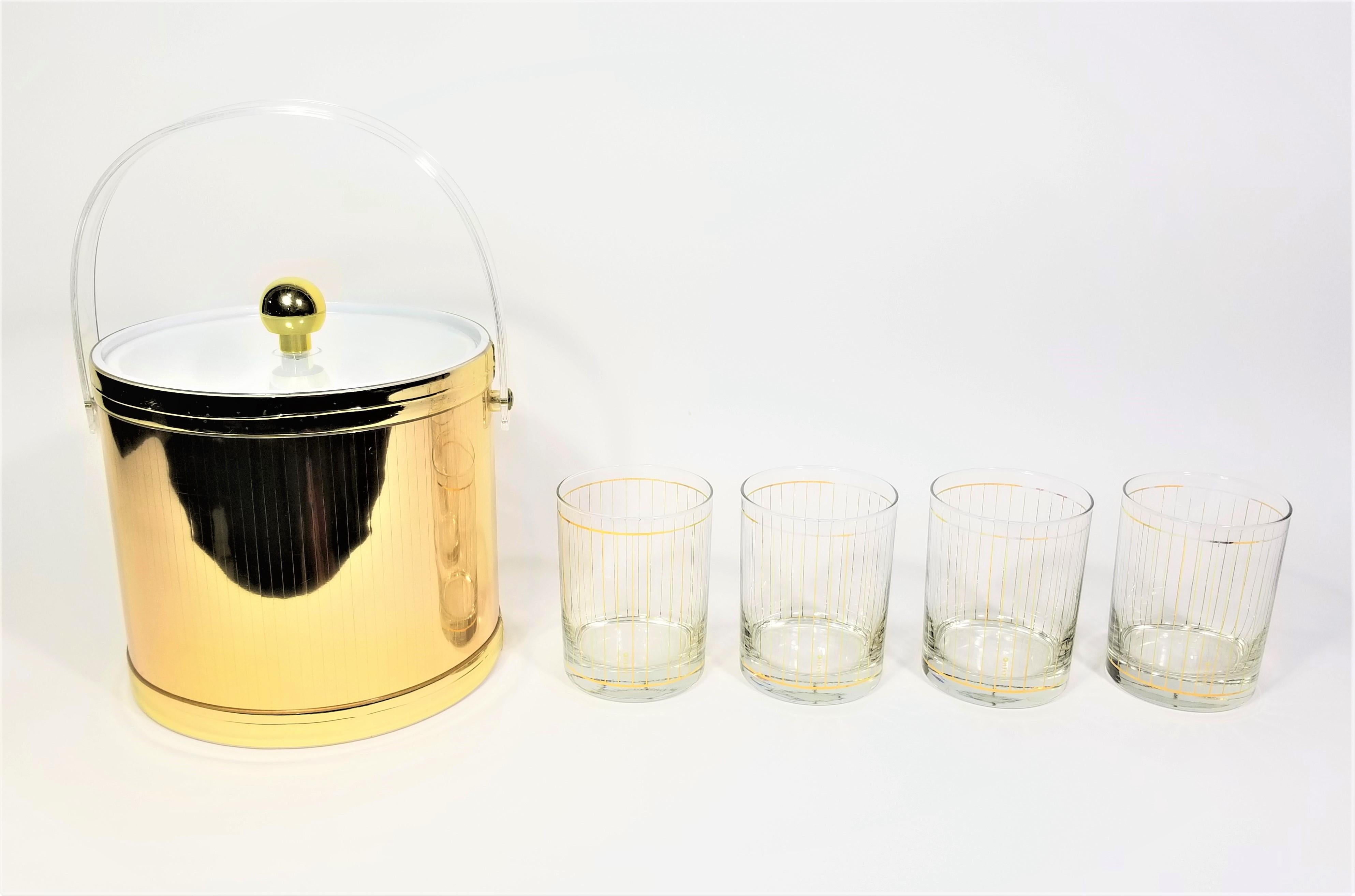 Mid century 1970s Culver 22K set of 4 double old fashioned glasses with gold ice bucket. All glasses marked Culver. 
Some light wear to gold detail on glasses. Original Box included.

Box height: 12.25 inches
Box width: 8.5 inches
Box depth: 8.5
