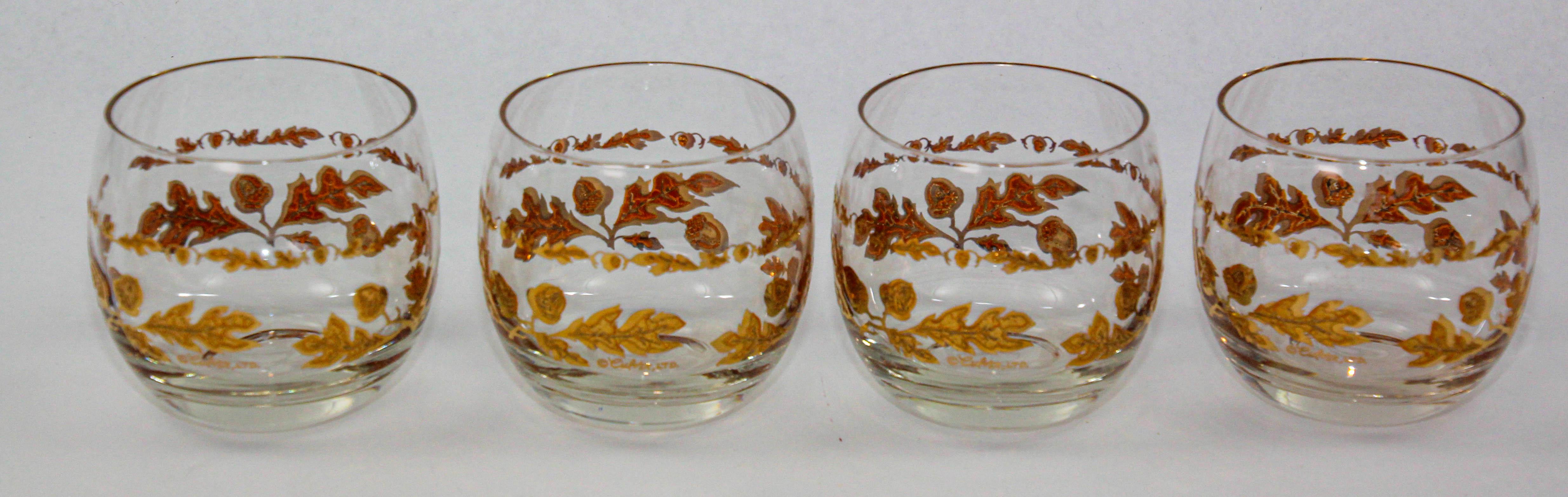 Mid-20th century Hollywood Regency 22-Karat gold set of 4 Roly Poly rock glasses by Culver Ltd. Set features a 22-Karat gold embossed floral Chantilly pattern motif.Enhance your barware collection with this limited edition Culver Roly Poly set of 4