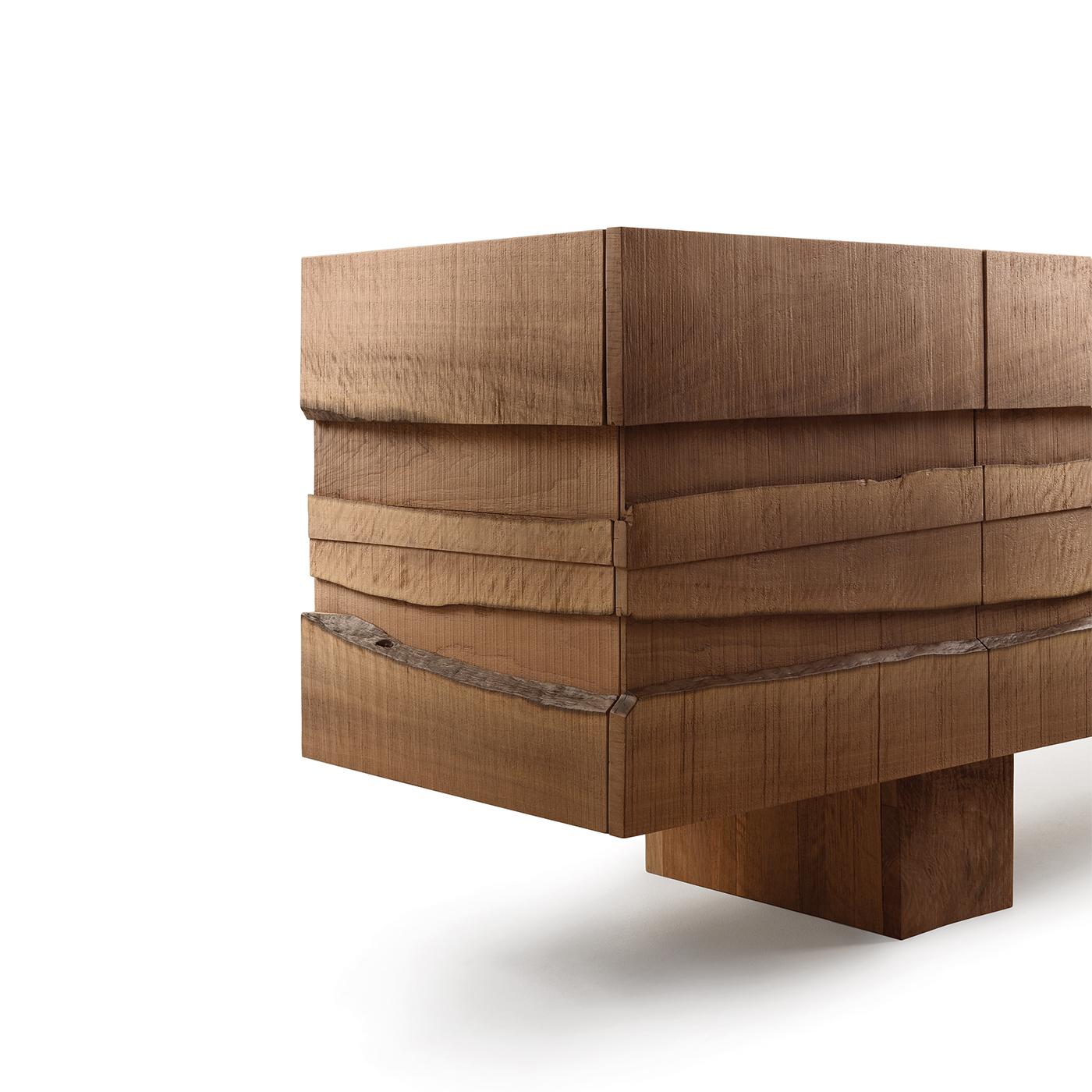 A superb showcase of skillful craftsmanship, this striking sideboard is a singular work of functional art exquisitely designed by Marc Sadler. Handcrafted of prized national walnut wood with a natural finish, the five doors of this piece are