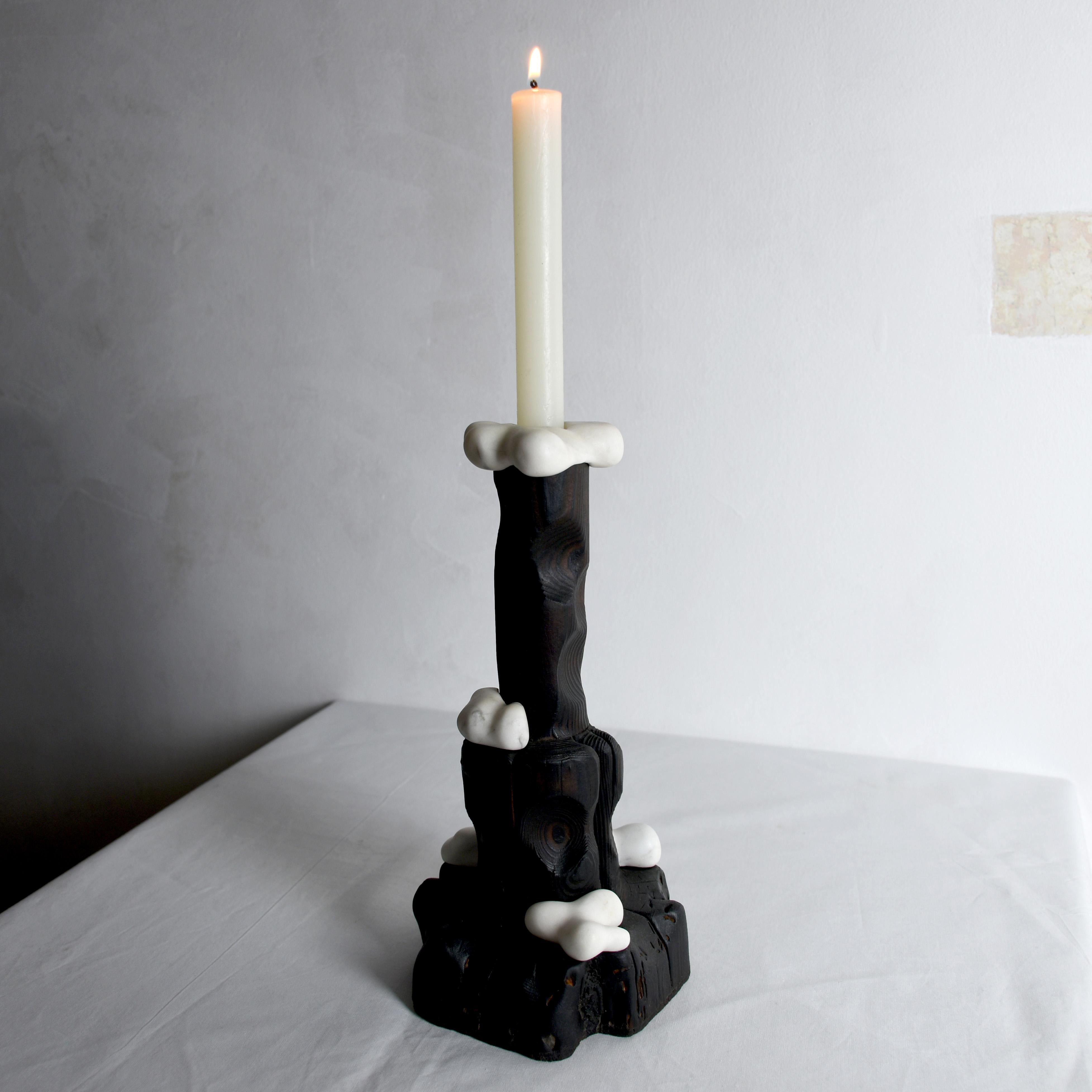 This artfully sculpted candle holder is a testament to innovative reuse, handcrafted from repurposed wood and remnants of pristine white marble. With delicate precision, I've enhanced the wood using the traditional Japanese Yakisugi method, and it's