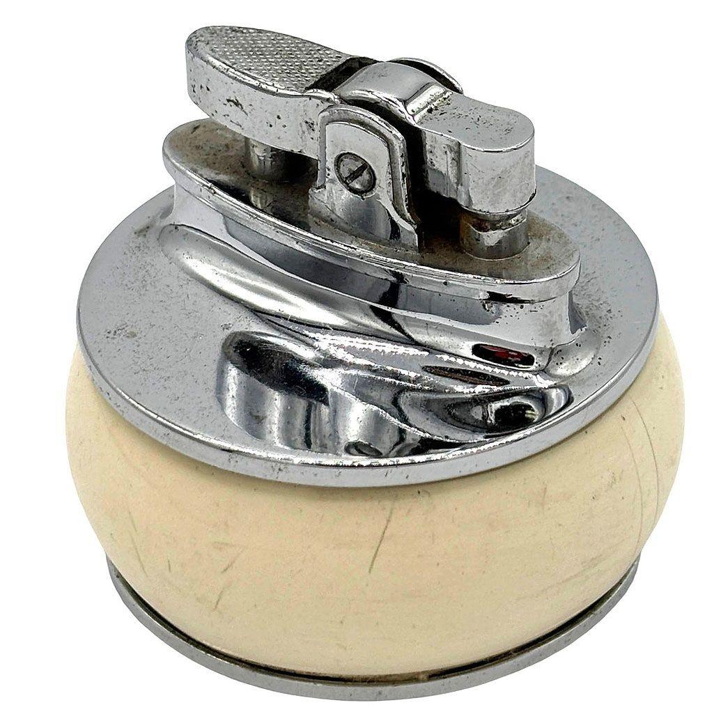 This charming lighter from the Cunard Line's RMS Queen Elizabeth. Produced by Rolstar in England, this lighter features a chrome body with an ivory-colored enamel center featuring the text RMS 