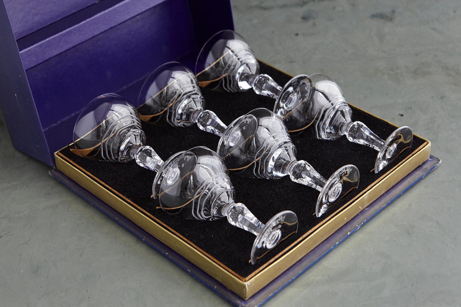 A highly searched after complete set of 6 stemmed crystal cocktail glasses with the famous wave pattern contained in the original Stuart Crystal fitted blue presentation box, exclusively made for the Cunard Steamship Co Ltd for the RMS Queen