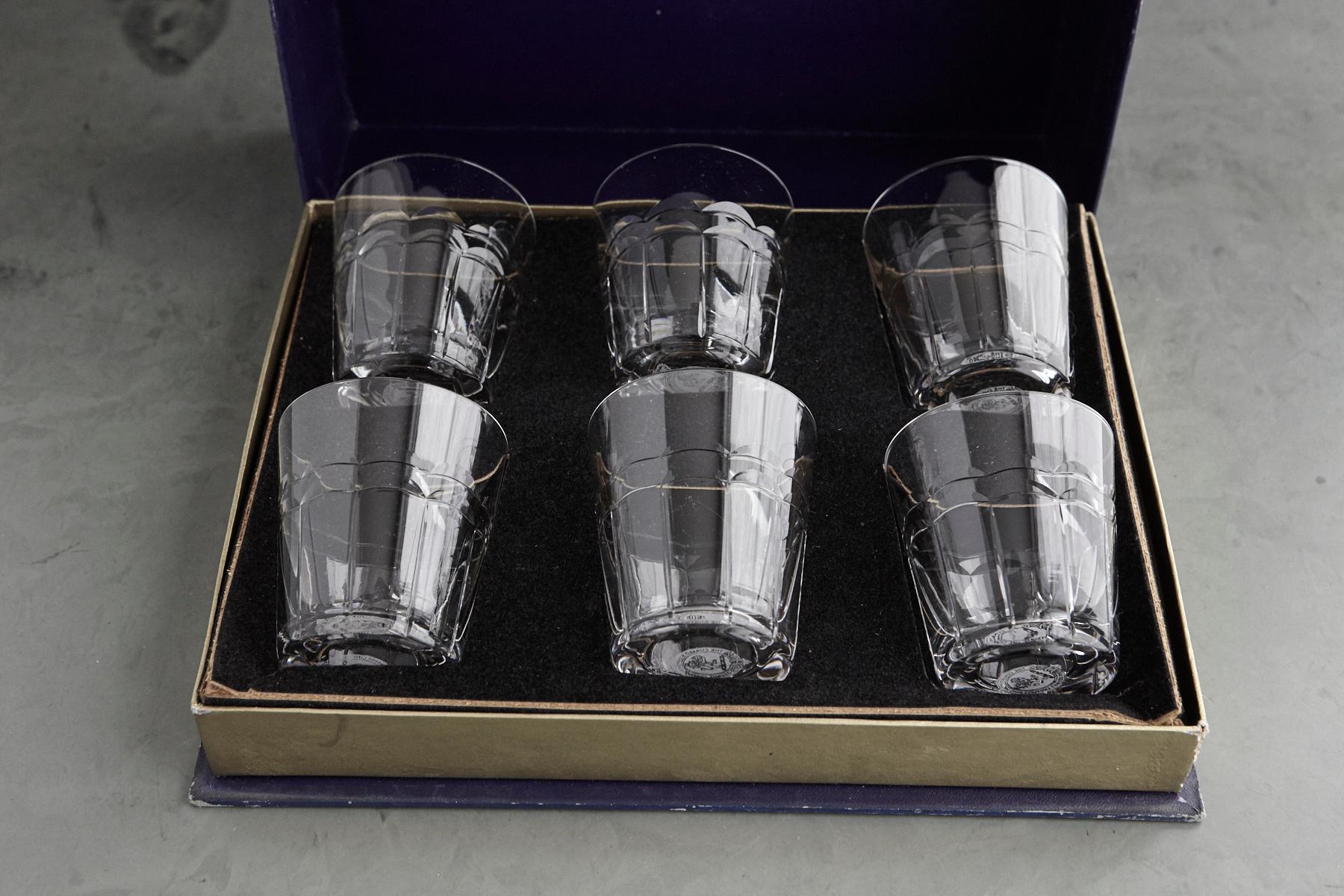 A highly searched after complete set of 6 crystal tumblers with the famous wave pattern contained in the original Stuart Crystal fitted blue presentation box, exclusively made for the Cunard Steamship Co Ltd for the RMS Queen Elizabeth. The glasses