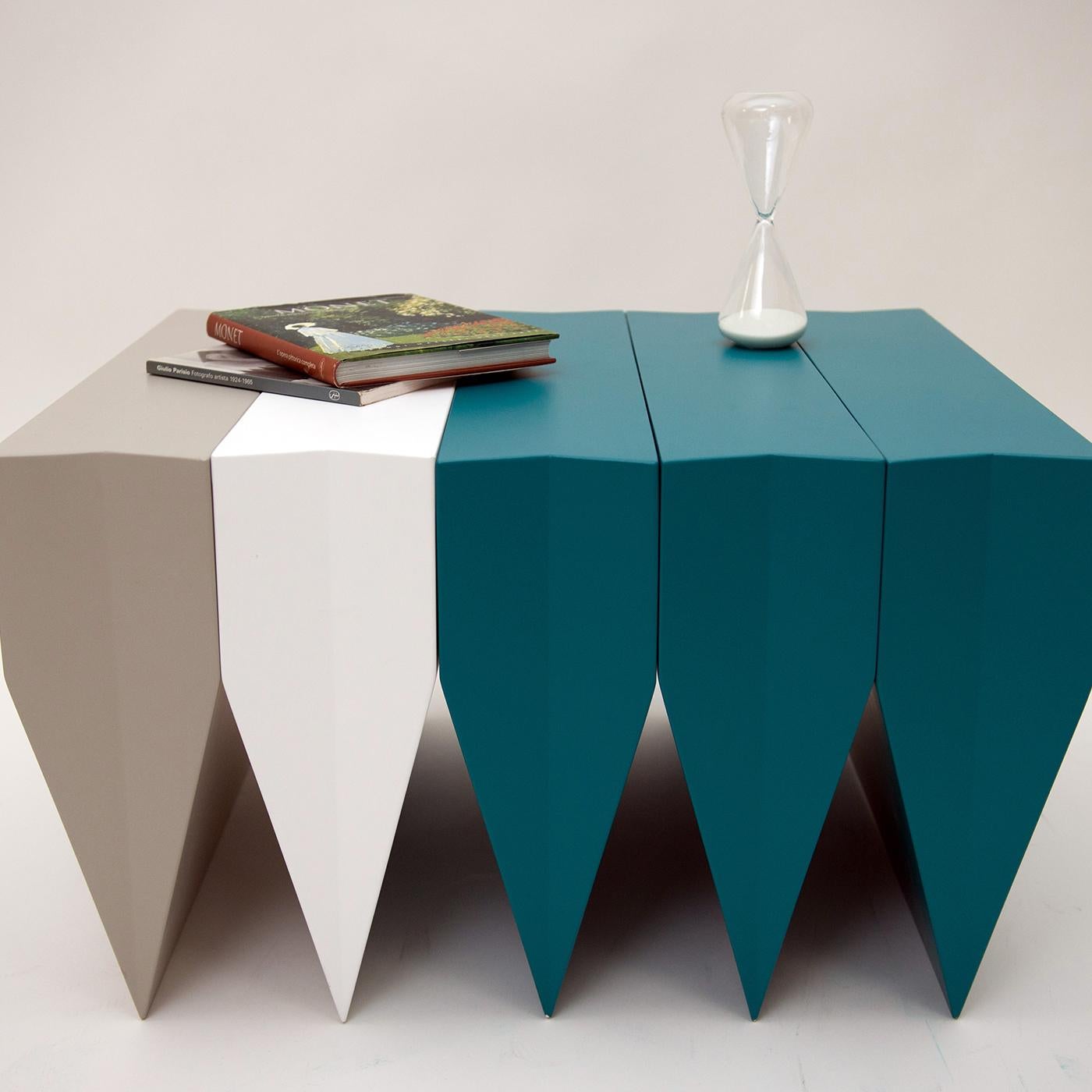 The multi wedge coffee table by Alberto Guarriello makes a remarkable statement of strength with its bold and contemporary style. A study of how the repetition of unstable elements can come together to produce one solid item of exceptional