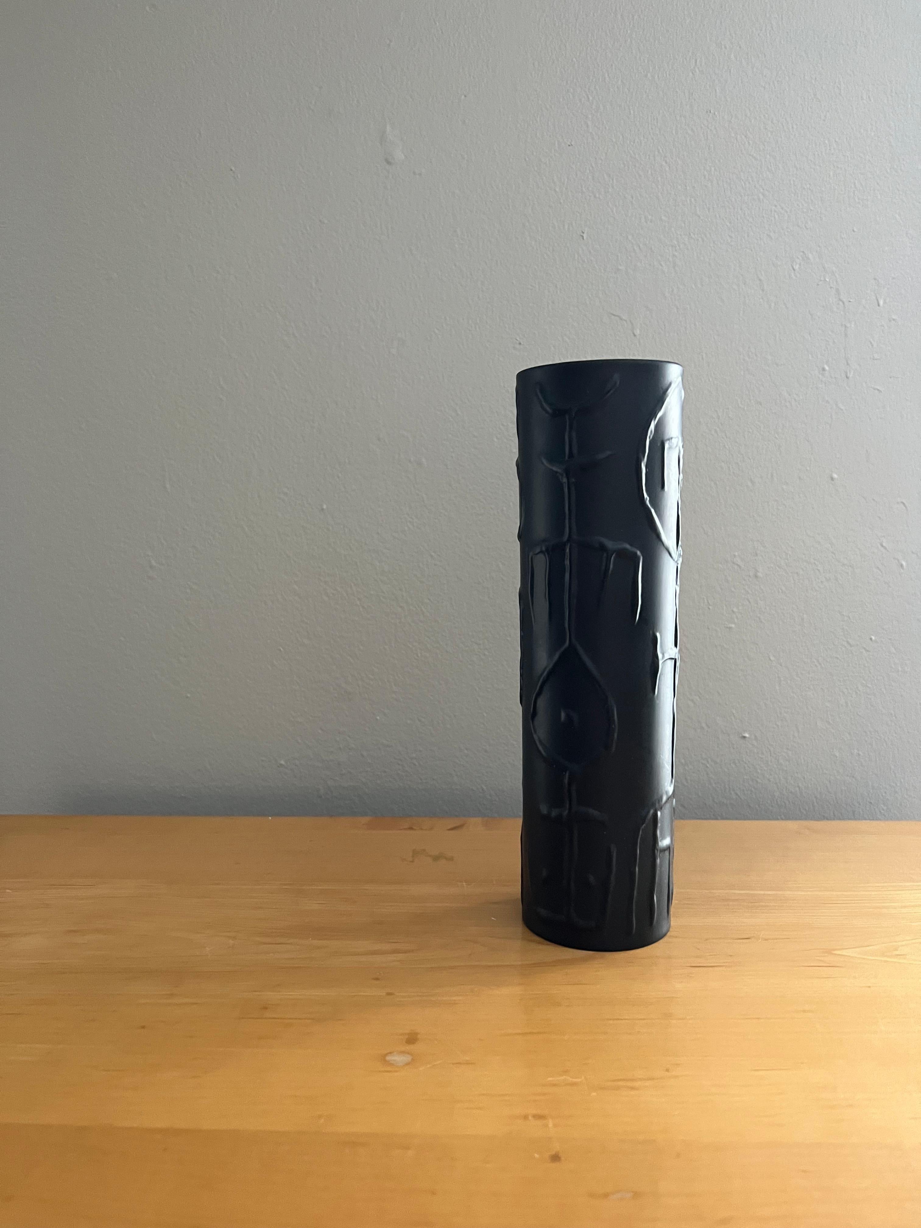 Raised abstract glyphs decorate this slender vase by Cuno Fischer for Rosenthal. A perfect addition to your Cuno Fischer collection or alongside Georges Jouve and other modernist ceramics.

Light wear throughout. Marked Rosenthal on the bottom. 