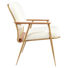 Fauteuil Cuore en acier au carbone, tapissé de peau de mouton et de bois